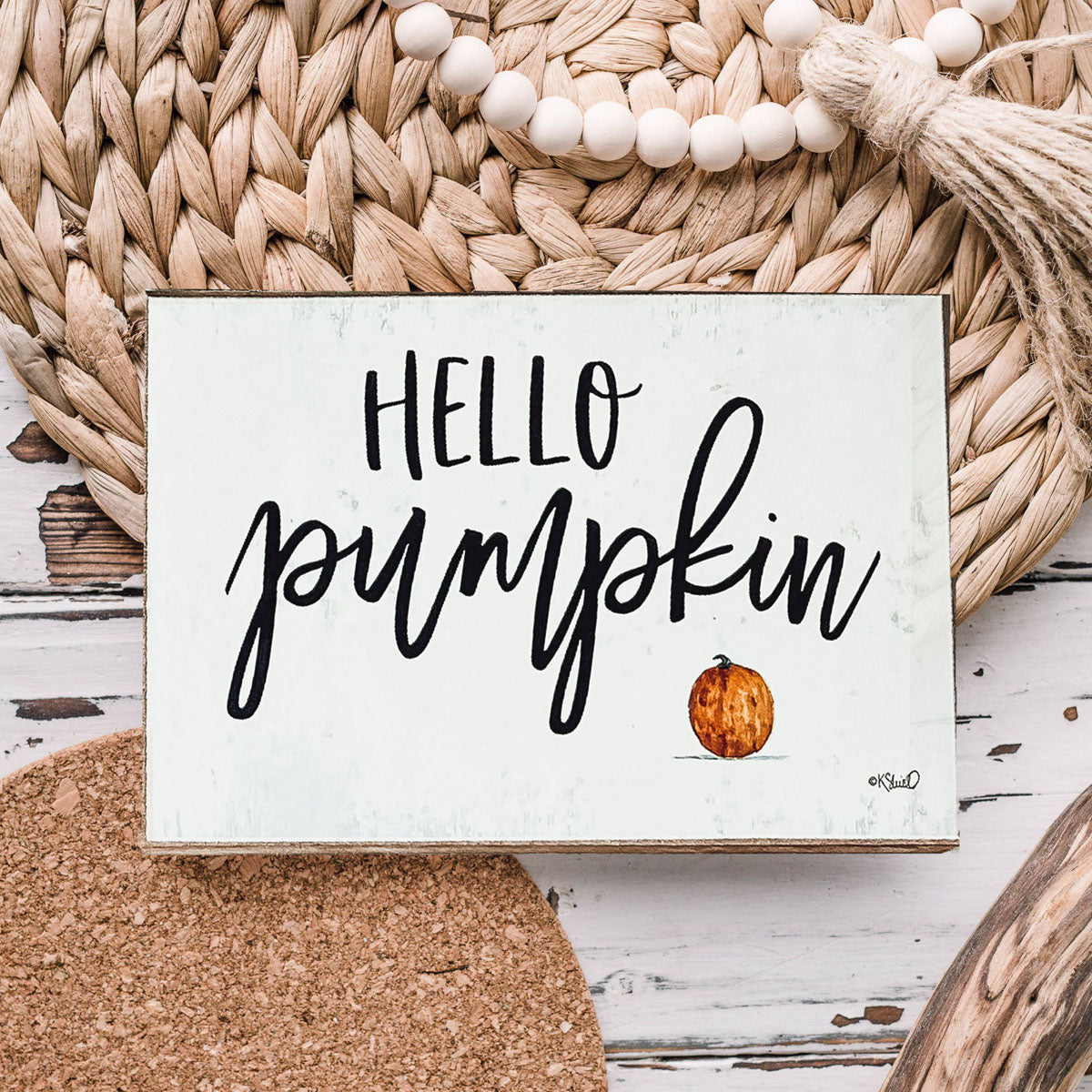 Hello Pumpkin wooden sign with rustic off-white background and black script, perfect for fall decor.