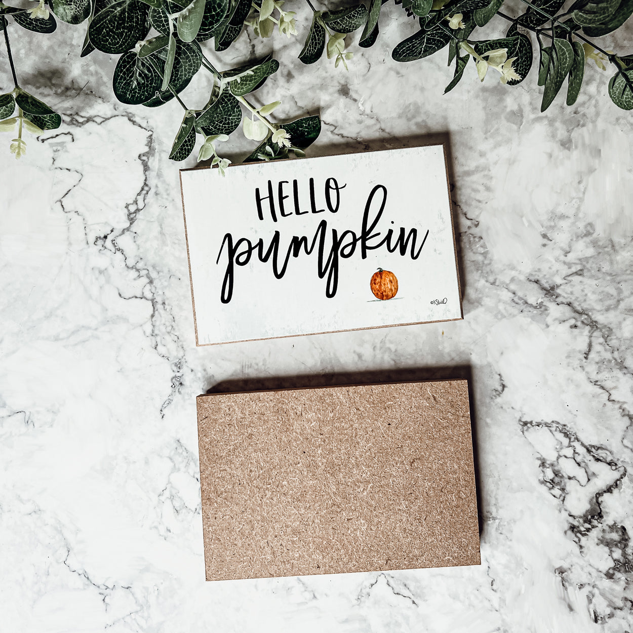 Hello Pumpkin wooden sign with rustic off-white background and black script, perfect for fall decor.