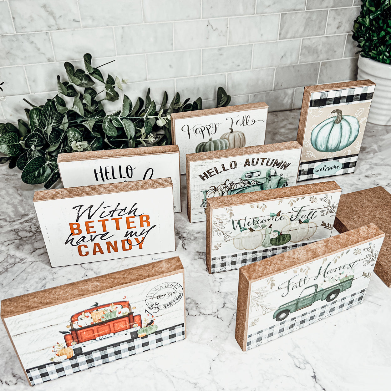 Hello Pumpkin wooden sign with rustic off-white background and black script, perfect for fall decor.