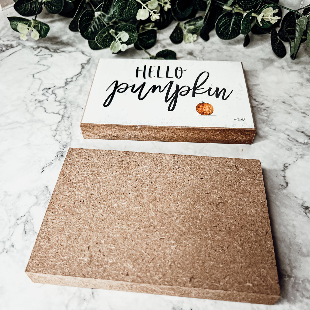 Hello Pumpkin wooden sign with rustic off-white background and black script, perfect for fall decor.