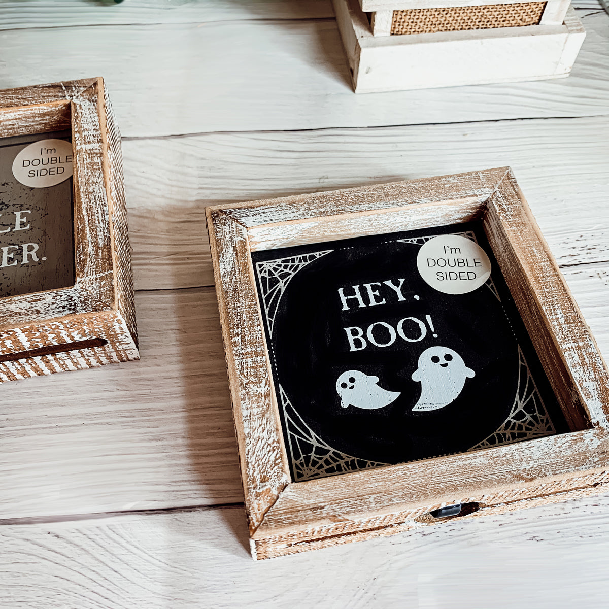 A double-sided wooden sign featuring 'Hey Boo' on one side and 'It's Cuddle Weather' on the other, measuring 5x5 inches.