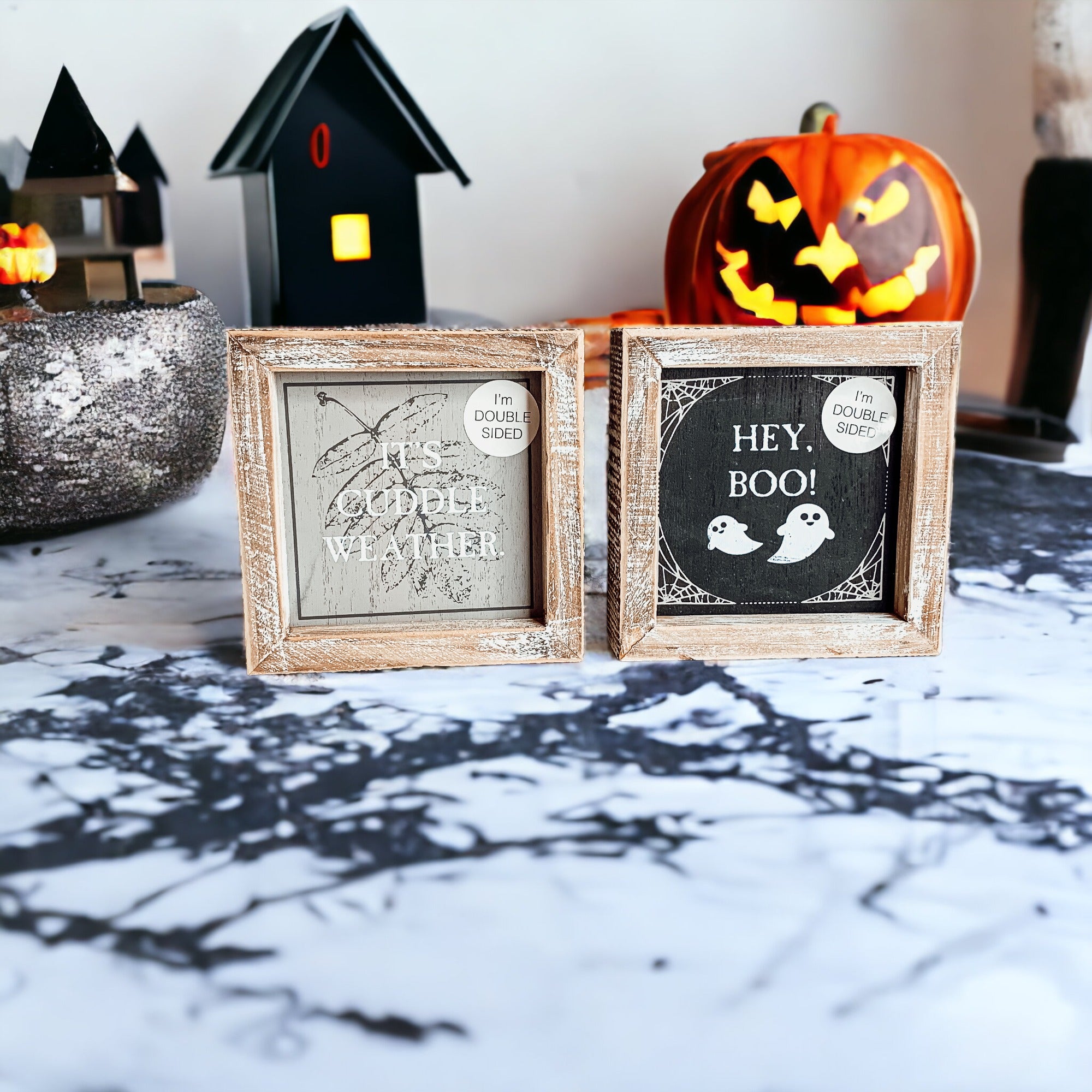 A double-sided wooden sign featuring 'Hey Boo' on one side and 'It's Cuddle Weather' on the other, measuring 5x5 inches.