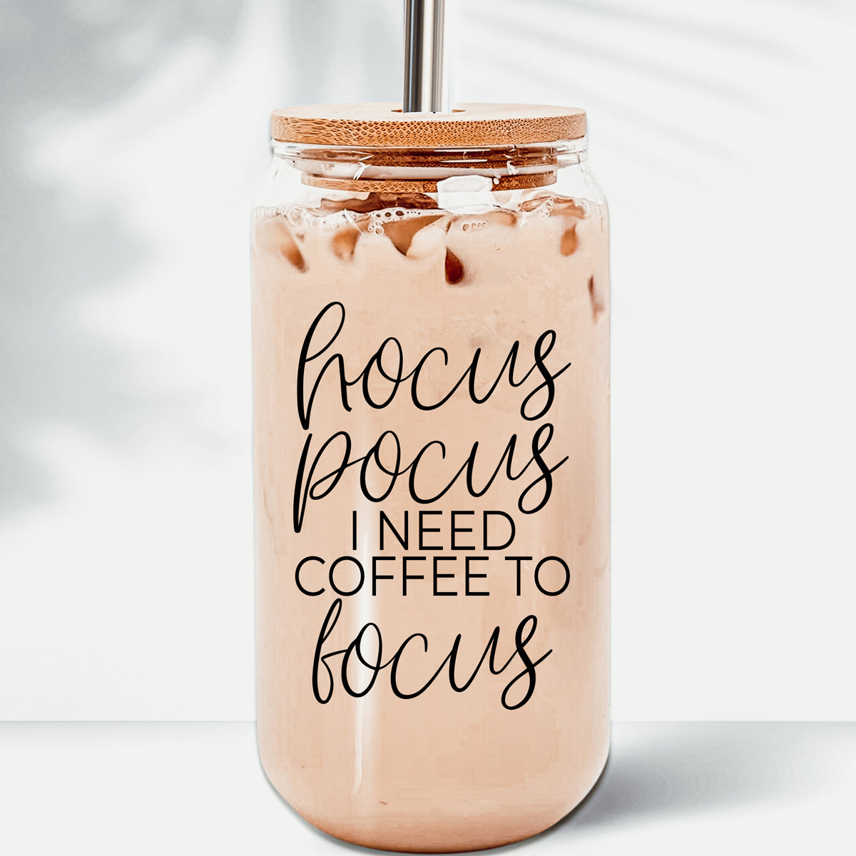 Hocus Pocus Cup with bamboo lid and stainless steel straws, featuring a black graphic design, ideal for hot and cold beverages.