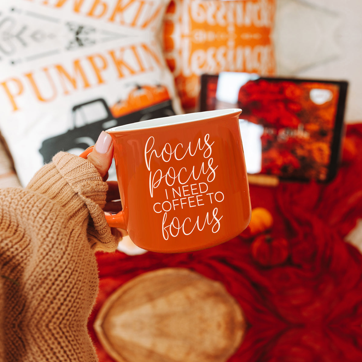 Hocus Pocus Mug in vibrant orange with white lettering, featuring the phrase 'Hocus Pocus I need Coffee to Focus!' on both sides, perfect for fall.