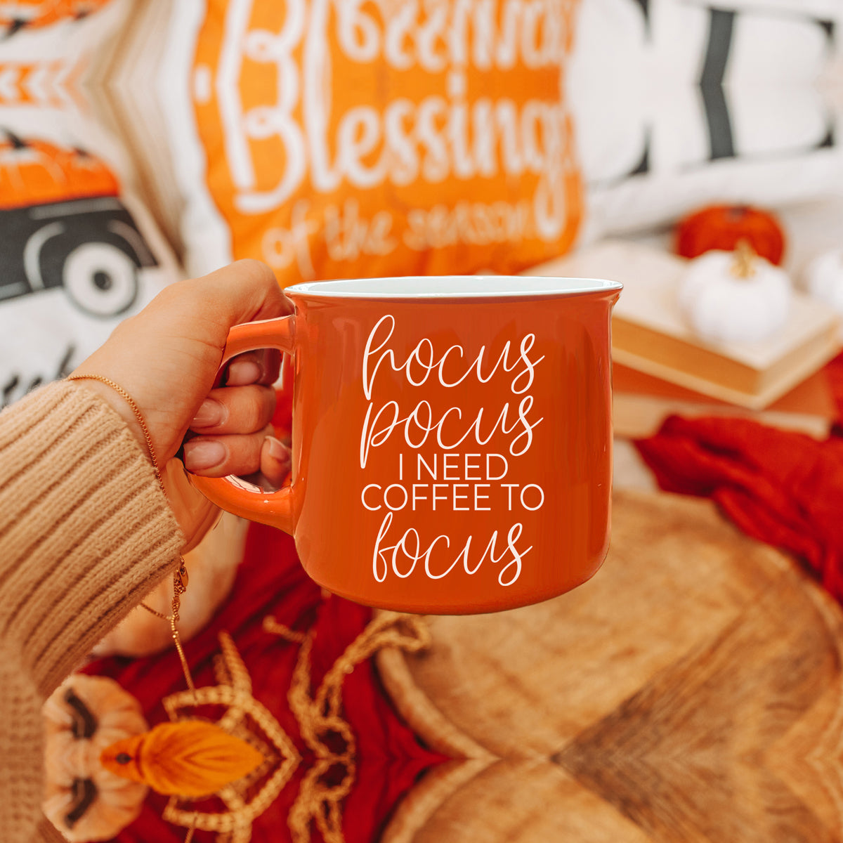 Hocus Pocus Mug in vibrant orange with white lettering, featuring the phrase 'Hocus Pocus I need Coffee to Focus!' on both sides, perfect for fall.