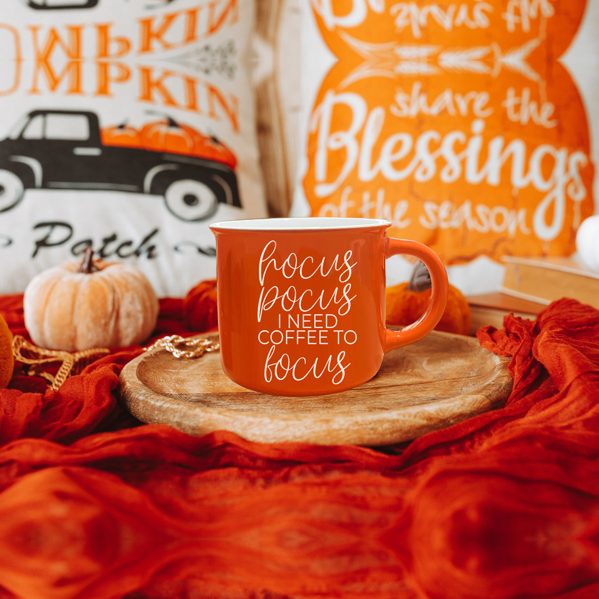 Hocus Pocus Mug in vibrant orange with white lettering, featuring the phrase 'Hocus Pocus I need Coffee to Focus!' on both sides, perfect for fall.