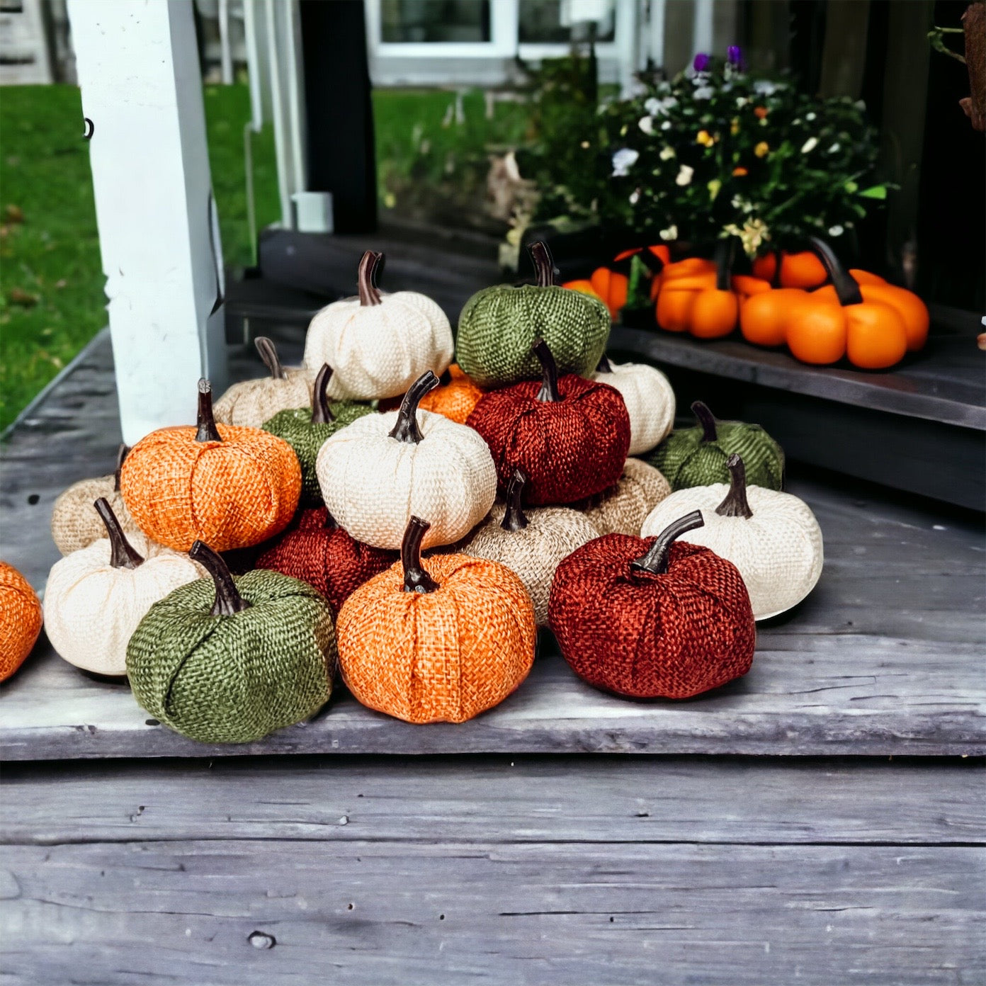 A collection of colorful jute mini pumpkins in various shades including burgundy, beige, green, ivory, and orange, perfect for fall decor.