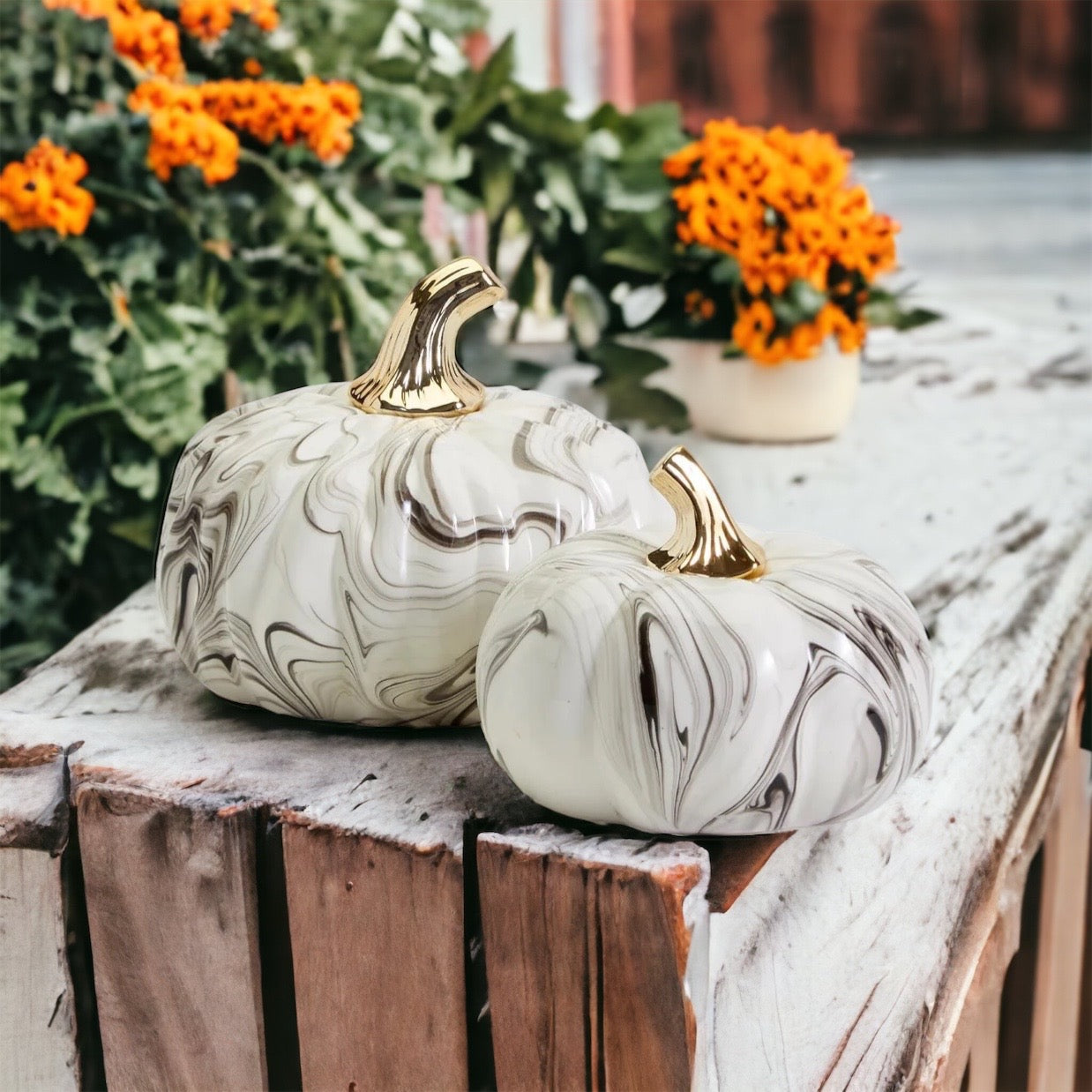 Martha Black Pumpkin featuring a unique marbled design and a luxurious gold-toned metallic stem, perfect for Halloween and year-round decor.