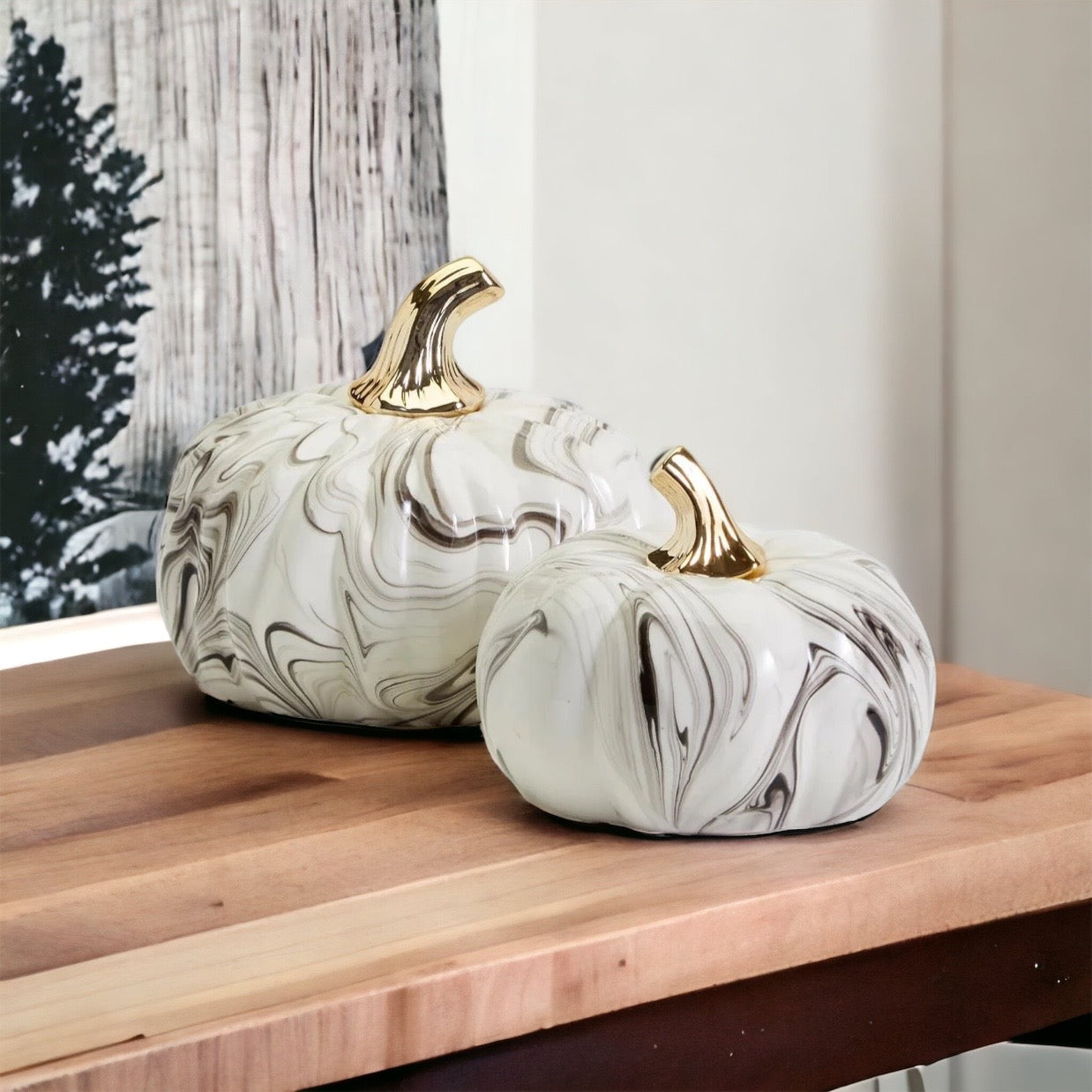 Martha Black Pumpkin featuring a unique marbled design and a luxurious gold-toned metallic stem, perfect for Halloween and year-round decor.