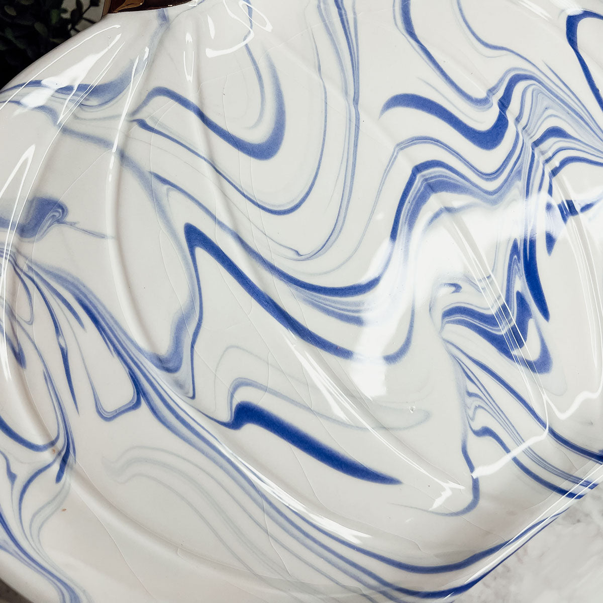 Martha Blue Pumpkin Plate set featuring marbled blue and white design with elegant gold stems, perfect for serving desserts.