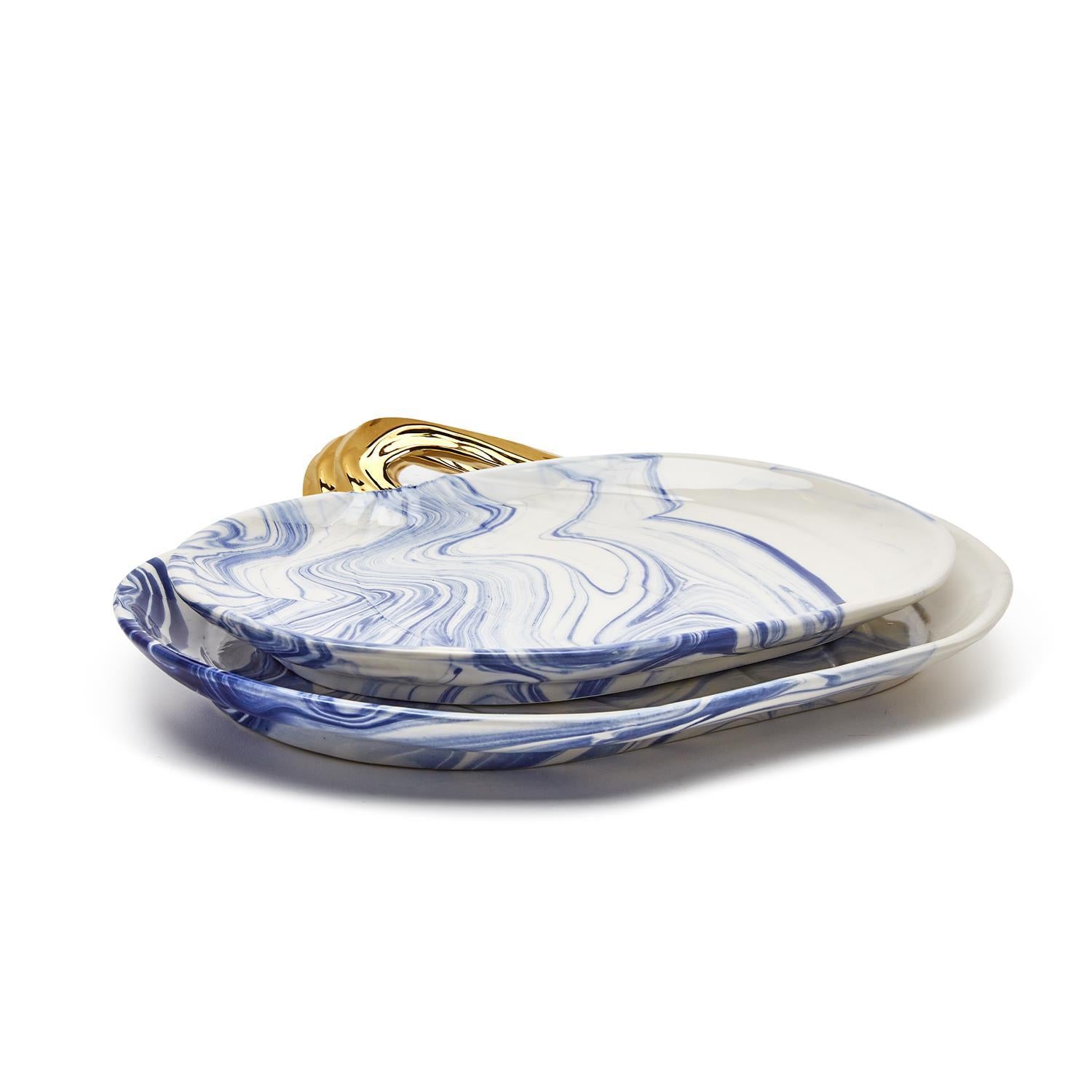 Martha Blue Pumpkin Plate set featuring marbled blue and white design with elegant gold stems, perfect for serving desserts.