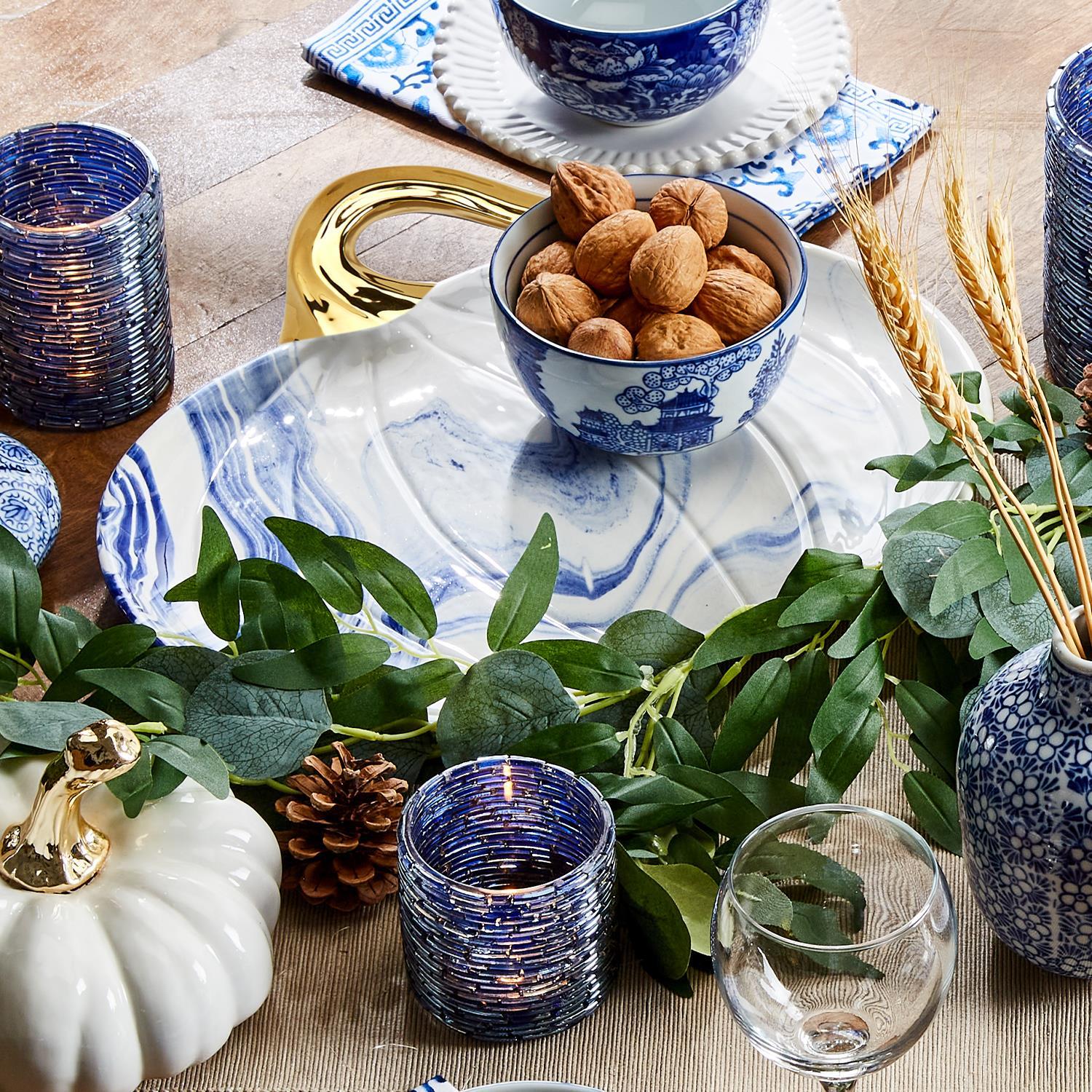 Martha Blue Pumpkin Plate set featuring marbled blue and white design with elegant gold stems, perfect for serving desserts.