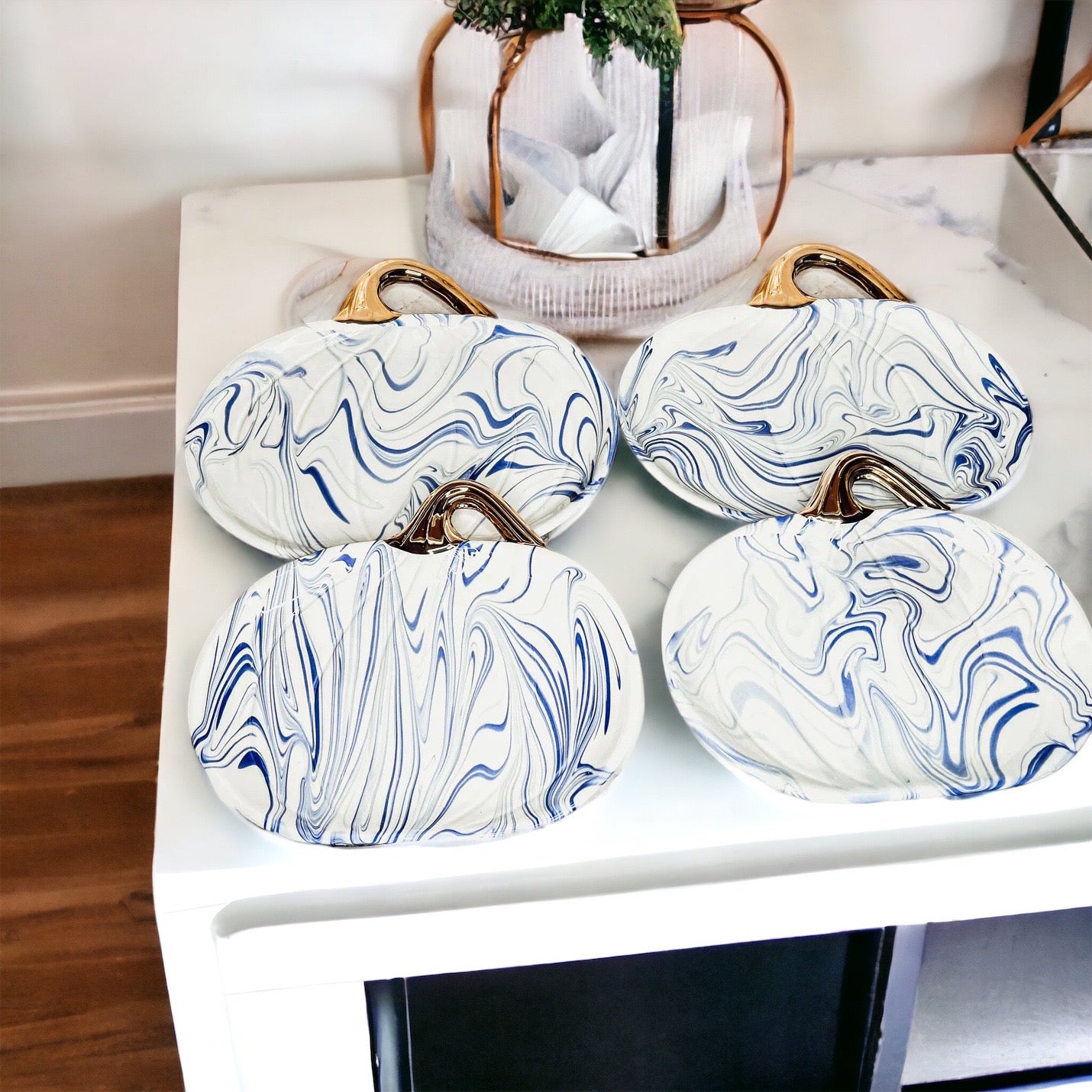 Martha Blue Pumpkin Plate set featuring marbled blue and white design with elegant gold stems, perfect for serving desserts.