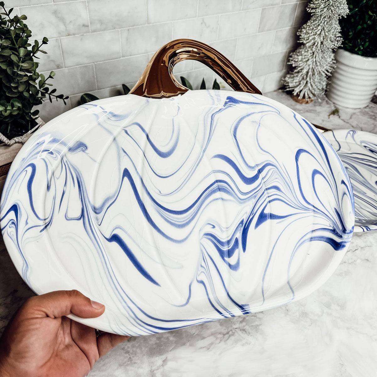 Martha Blue Pumpkin Plate set featuring marbled blue and white design with elegant gold stems, perfect for serving desserts.