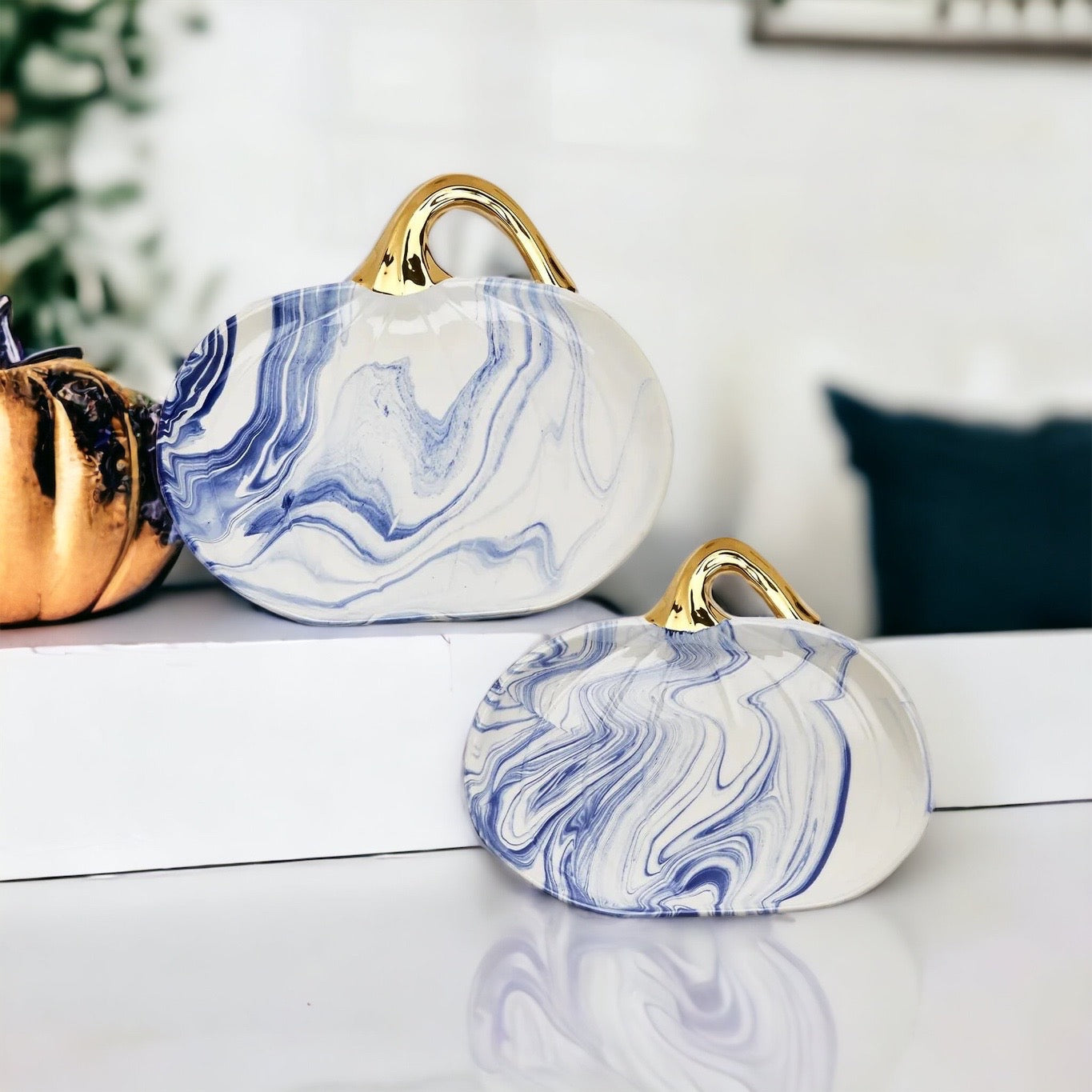 Martha Blue Pumpkin Plate set featuring marbled blue and white design with elegant gold stems, perfect for serving desserts.