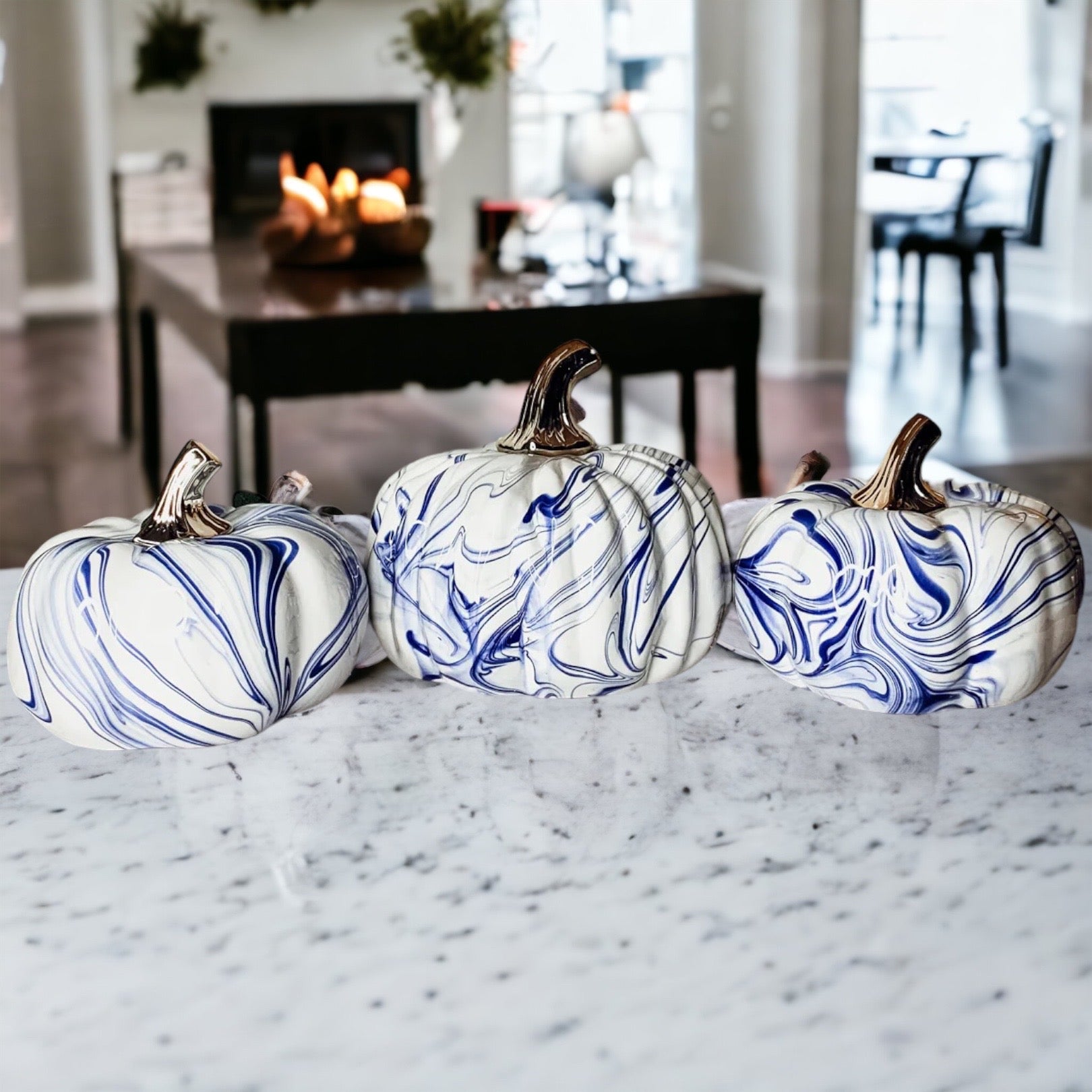 A stunning marbled blue pumpkin, handcrafted from dolomite, showcasing unique designs and elegant curves, perfect for Halloween decor.