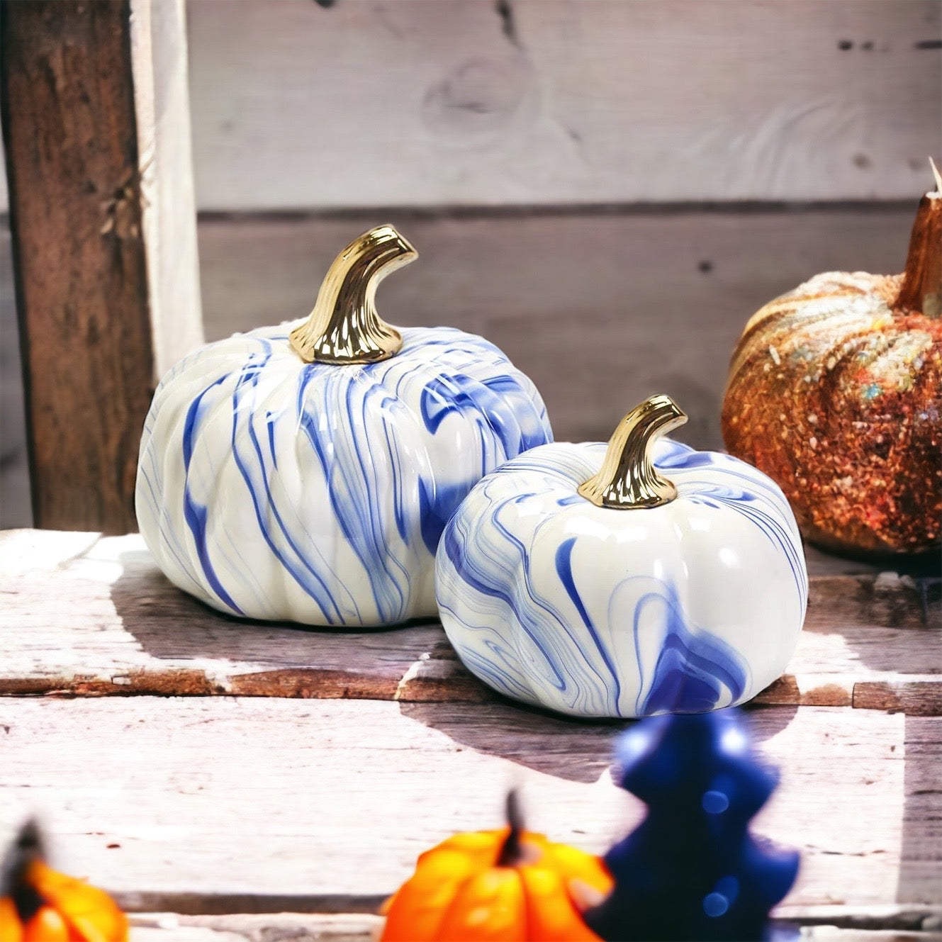 A stunning marbled blue pumpkin, handcrafted from dolomite, showcasing unique designs and elegant curves, perfect for Halloween decor.