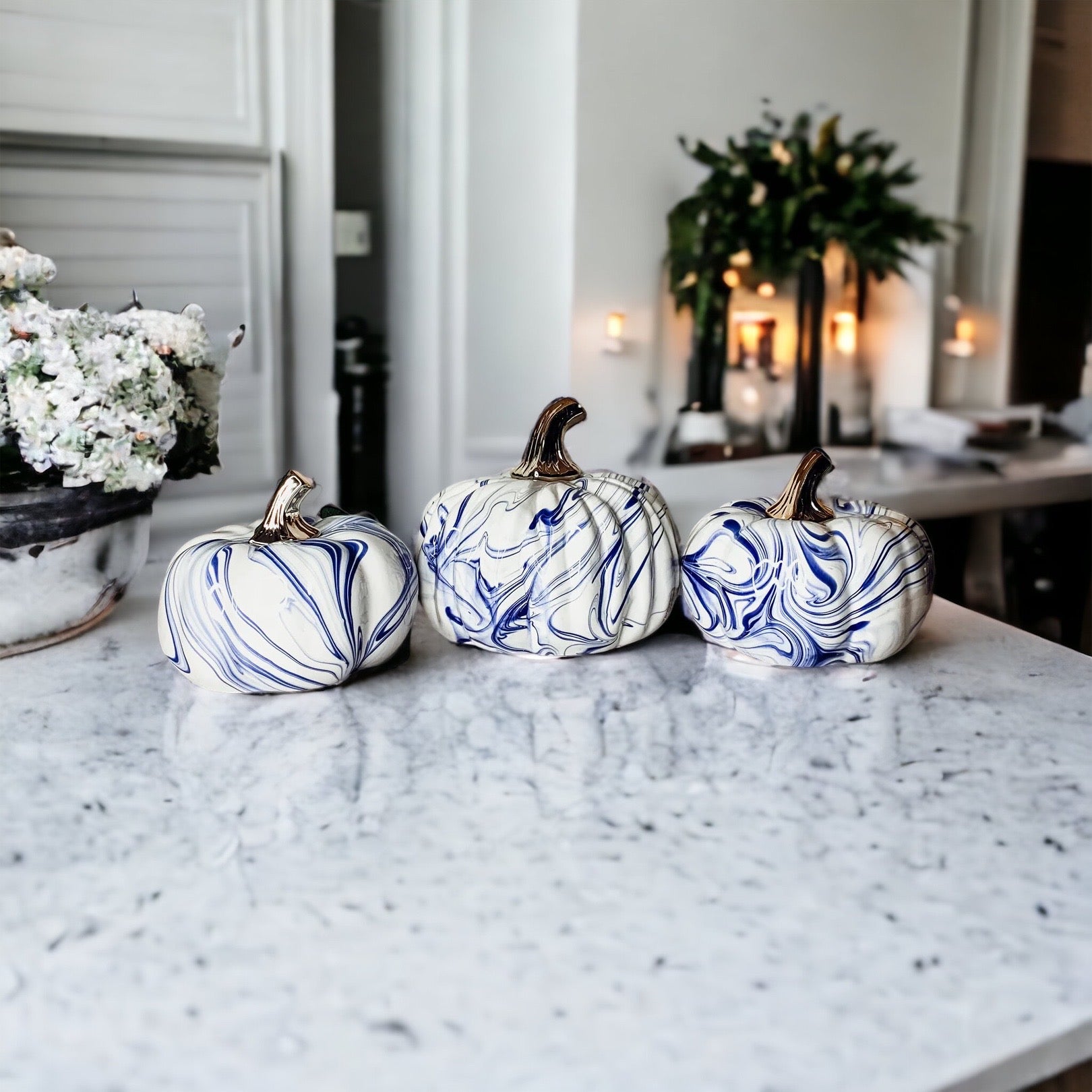 A stunning marbled blue pumpkin, handcrafted from dolomite, showcasing unique designs and elegant curves, perfect for Halloween decor.