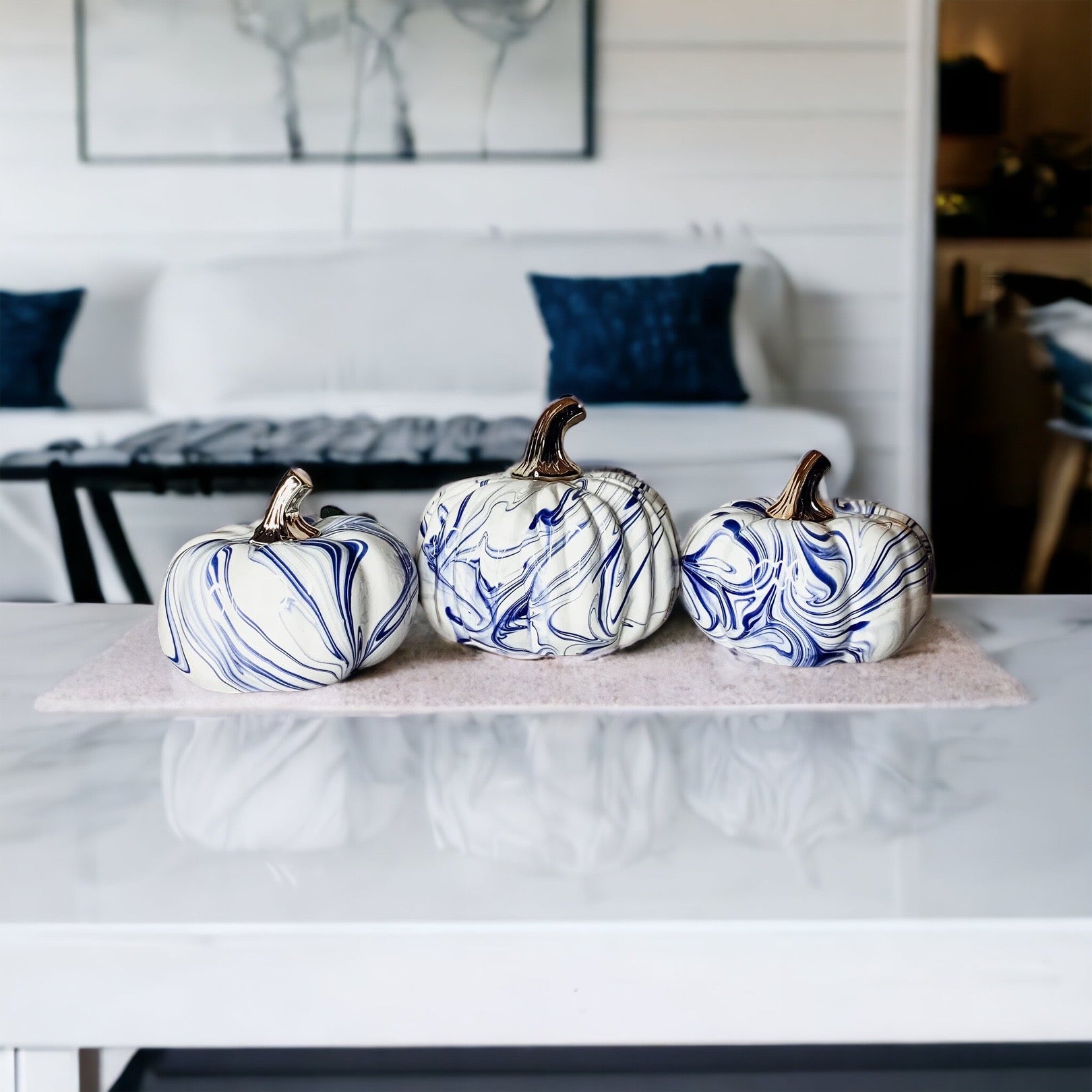 A stunning marbled blue pumpkin, handcrafted from dolomite, showcasing unique designs and elegant curves, perfect for Halloween decor.