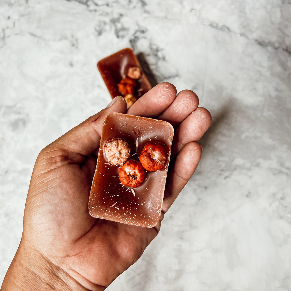 A close-up of Pumpkin Pecan Waffles wax melts, showcasing their rich color and texture, with a warm, inviting scent of autumn.