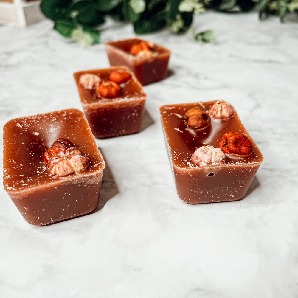 A close-up of Pumpkin Pecan Waffles wax melts, showcasing their rich color and texture, with a warm, inviting scent of autumn.