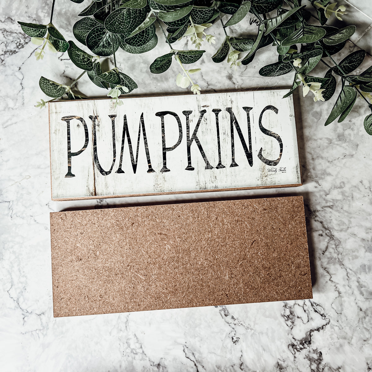 Rustic wooden pumpkins with a wood-like appearance, perfect for fall and Halloween decor.