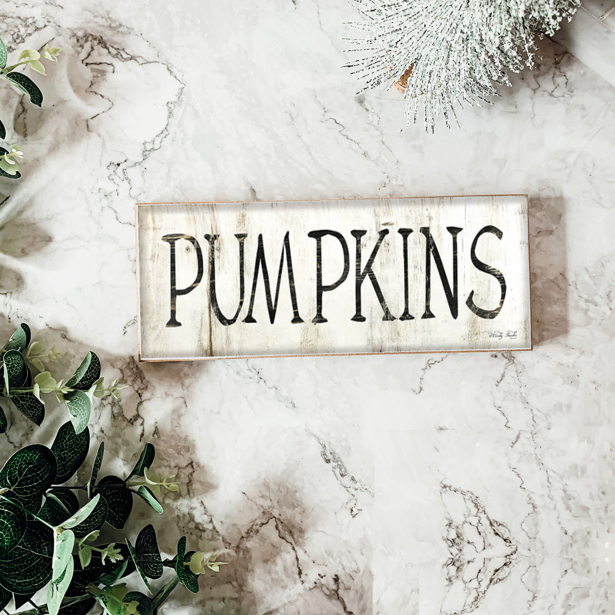 Rustic wooden pumpkins with a wood-like appearance, perfect for fall and Halloween decor.