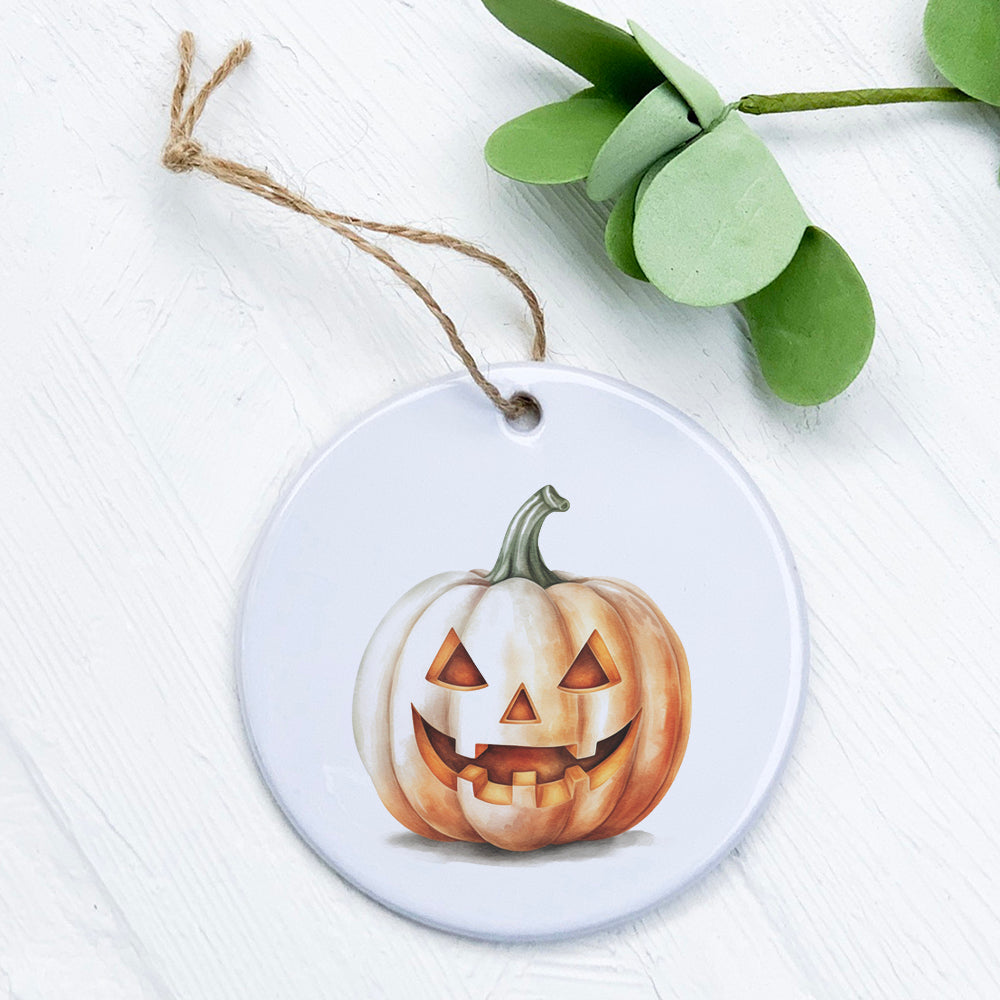 A beautifully crafted Watercolor Carved Pumpkin ornament made of high-quality porcelain, featuring a vibrant watercolor design.