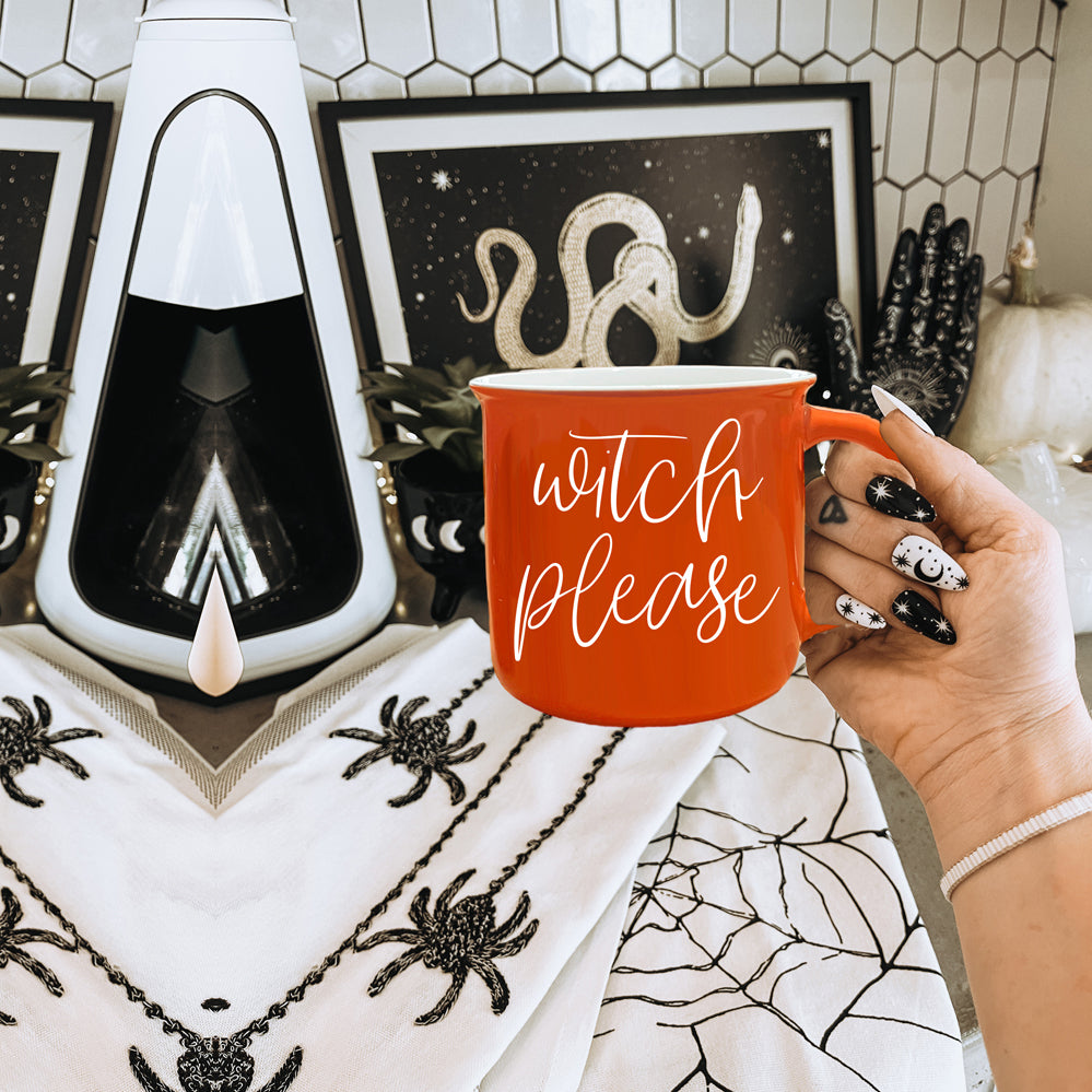 Witch Please Mug in vibrant orange with white lettering, featuring a whimsical design on both sides, perfect for fall beverages.