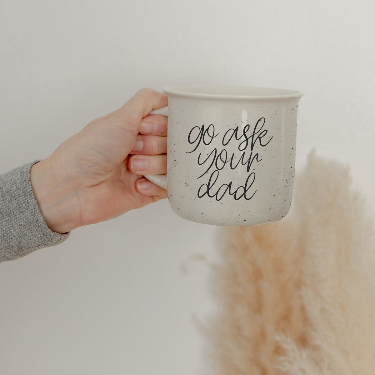 Go Ask Your Dad Ceramic Coffee Mug with light ivory glaze and black lettering, featuring a campfire style design, perfect for busy parents.