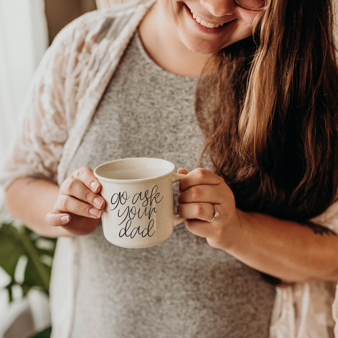 Go Ask Your Dad Ceramic Coffee Mug with light ivory glaze and black lettering, featuring a campfire style design, perfect for busy parents.