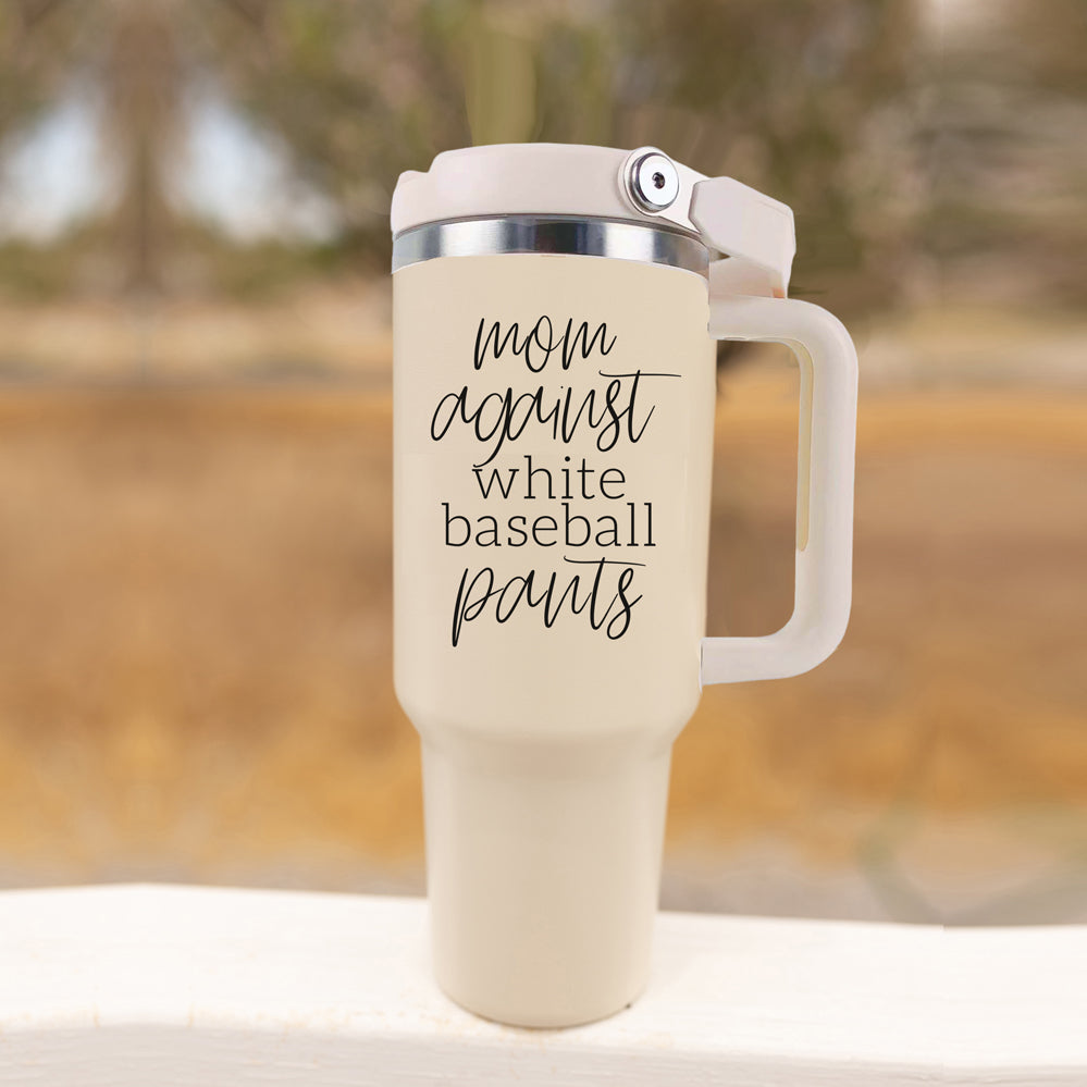 A stylish 40oz tumbler with a cream exterior and stainless steel interior, featuring the bold graphic 'Moms Against White Baseball Pants' on the front, designed for durability and practicality.