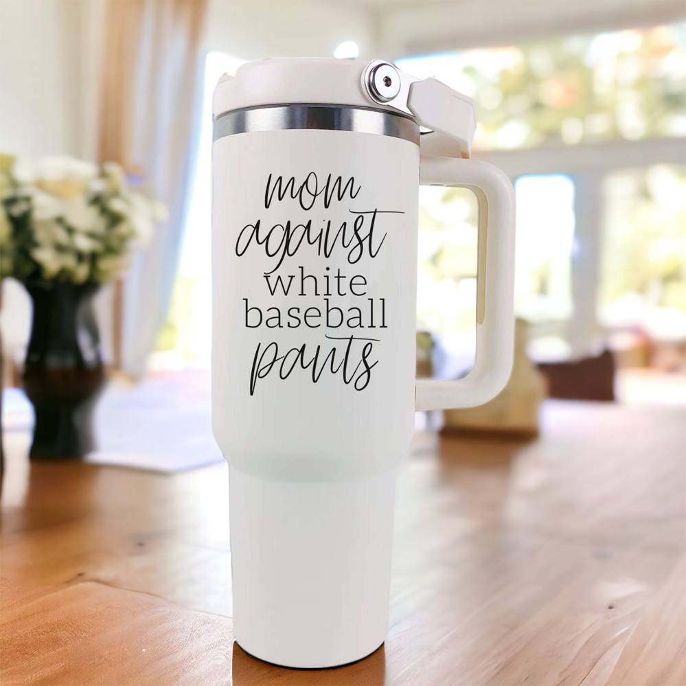 A stylish 40oz tumbler with a cream exterior and stainless steel interior, featuring the bold graphic 'Moms Against White Baseball Pants' on the front, designed for durability and practicality.