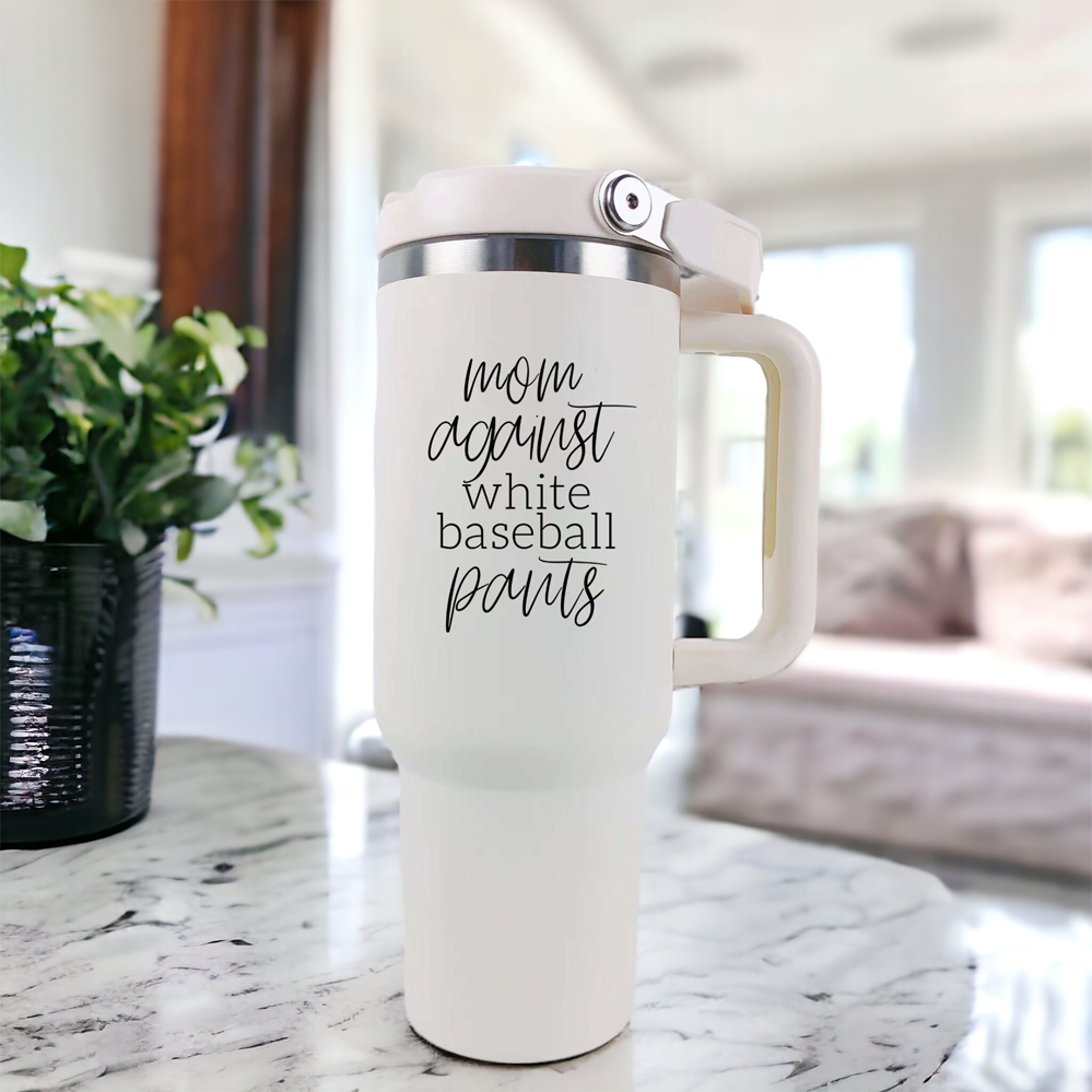 A stylish 40oz tumbler with a cream exterior and stainless steel interior, featuring the bold graphic 'Moms Against White Baseball Pants' on the front, designed for durability and practicality.