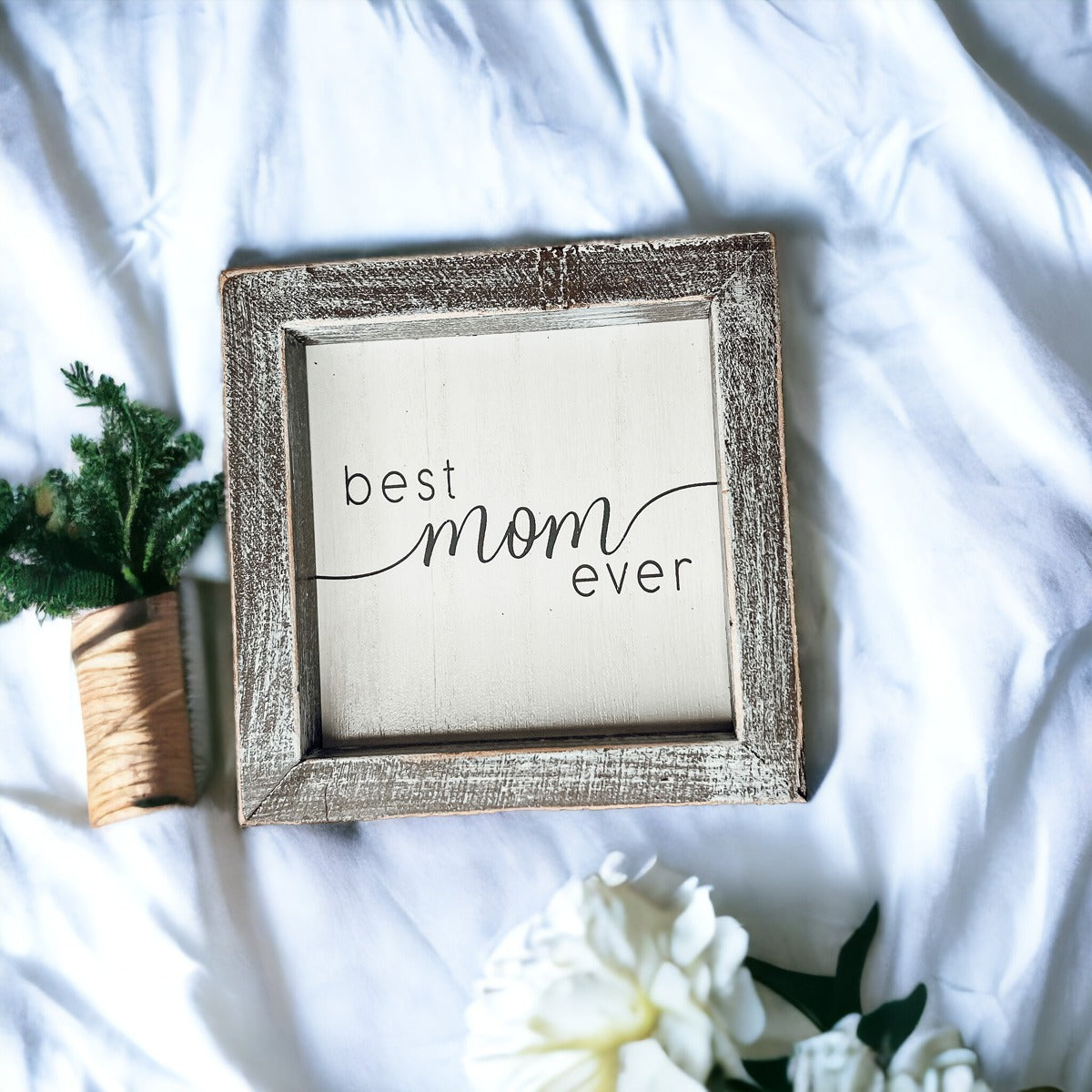 A rustic wooden framed sign displaying the quote 'Best Mom Ever', measuring 5x5x1.5 inches, perfect for home decor.