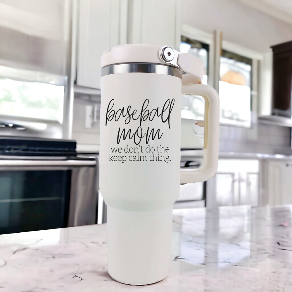 A stylish cream-colored 40oz tumbler with a stainless steel interior, featuring a bold black graphic that reads 'We Don't Do the Keep Calm Thing', designed for baseball moms.