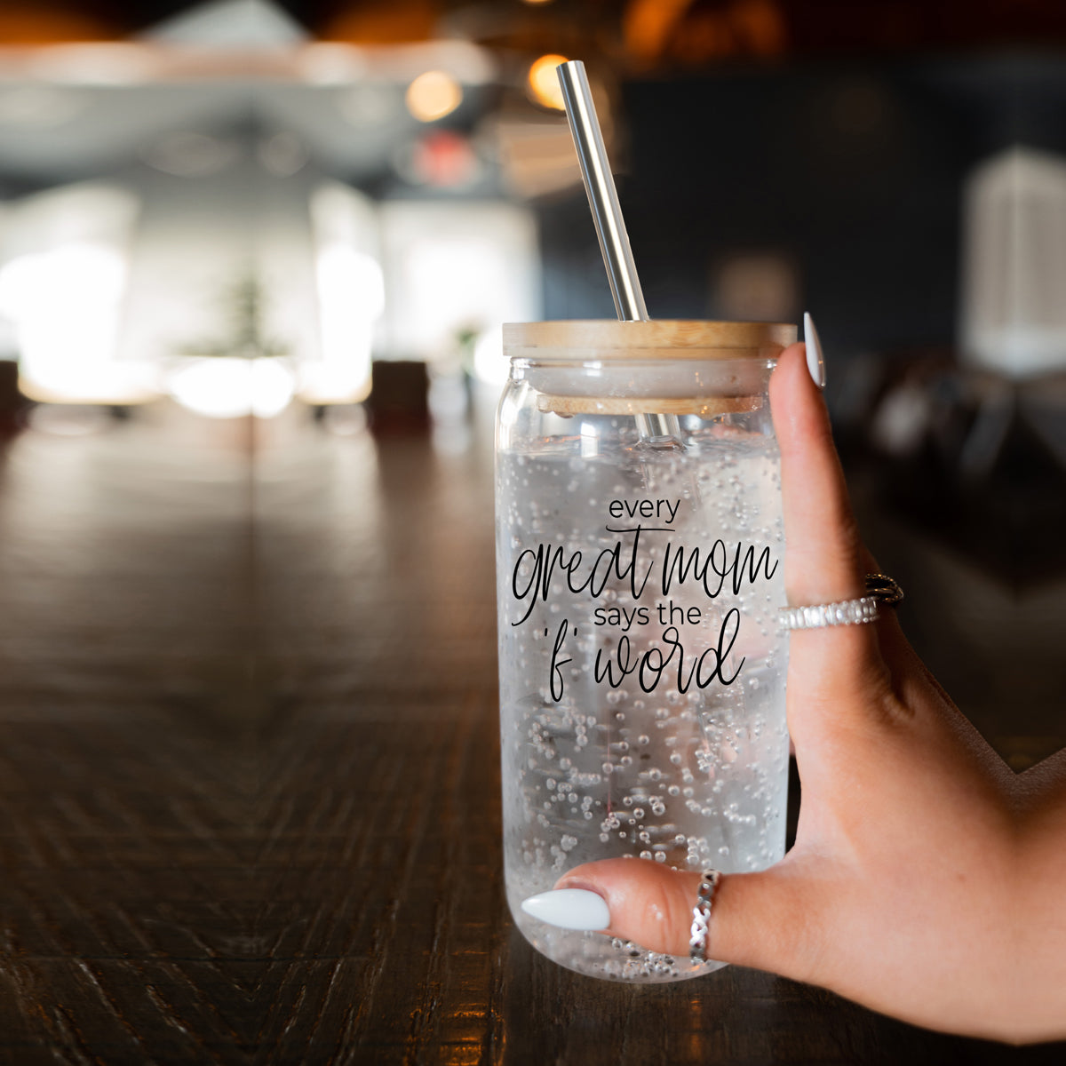 Every Great Mom Set featuring glass drinking cups with bamboo lids, stainless steel straws, and a straw cleaner, perfect for hot and cold beverages.