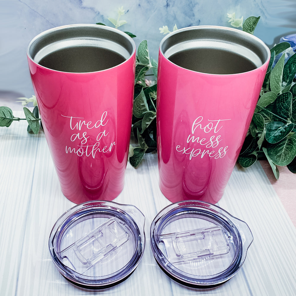 Pink travel mugs with humorous text