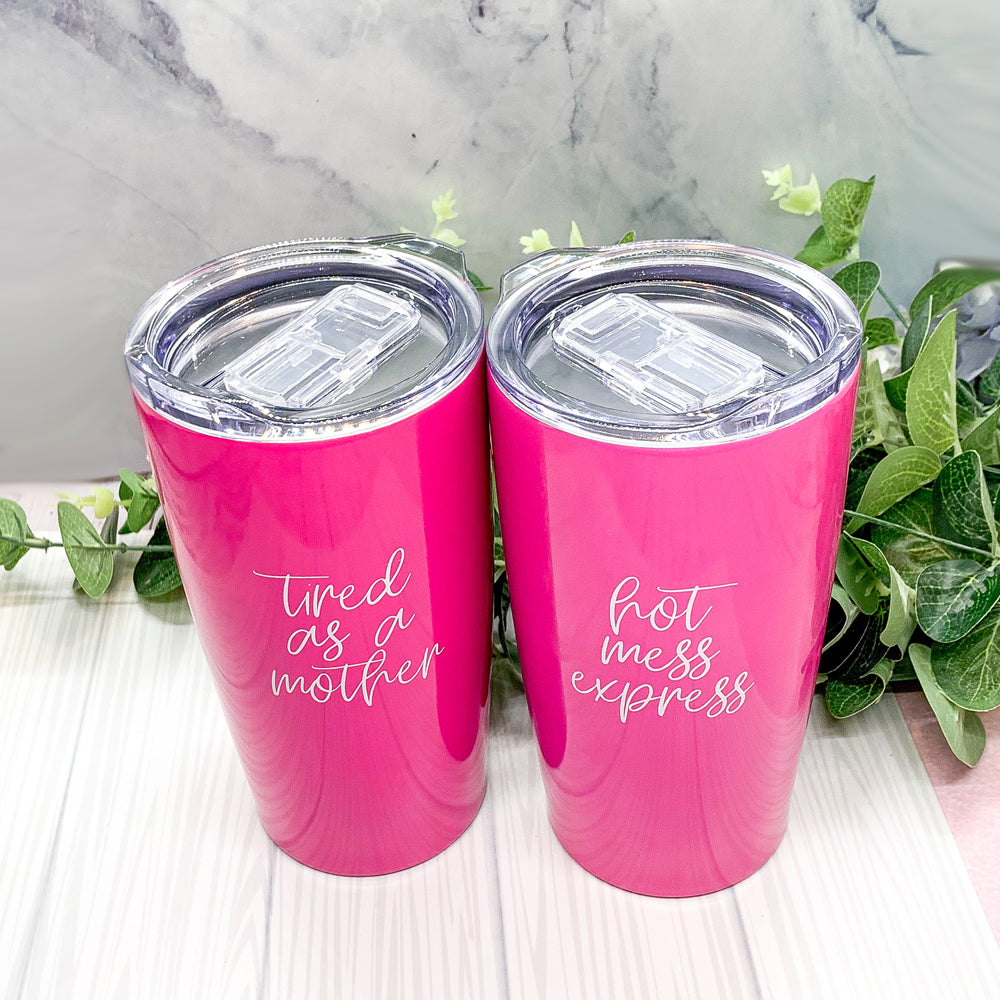 Pink tumblers with fun phrases.