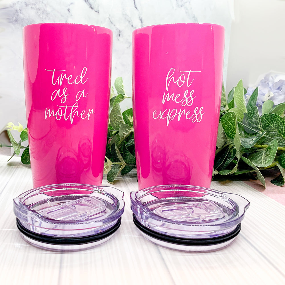 Two pink tumblers with text.