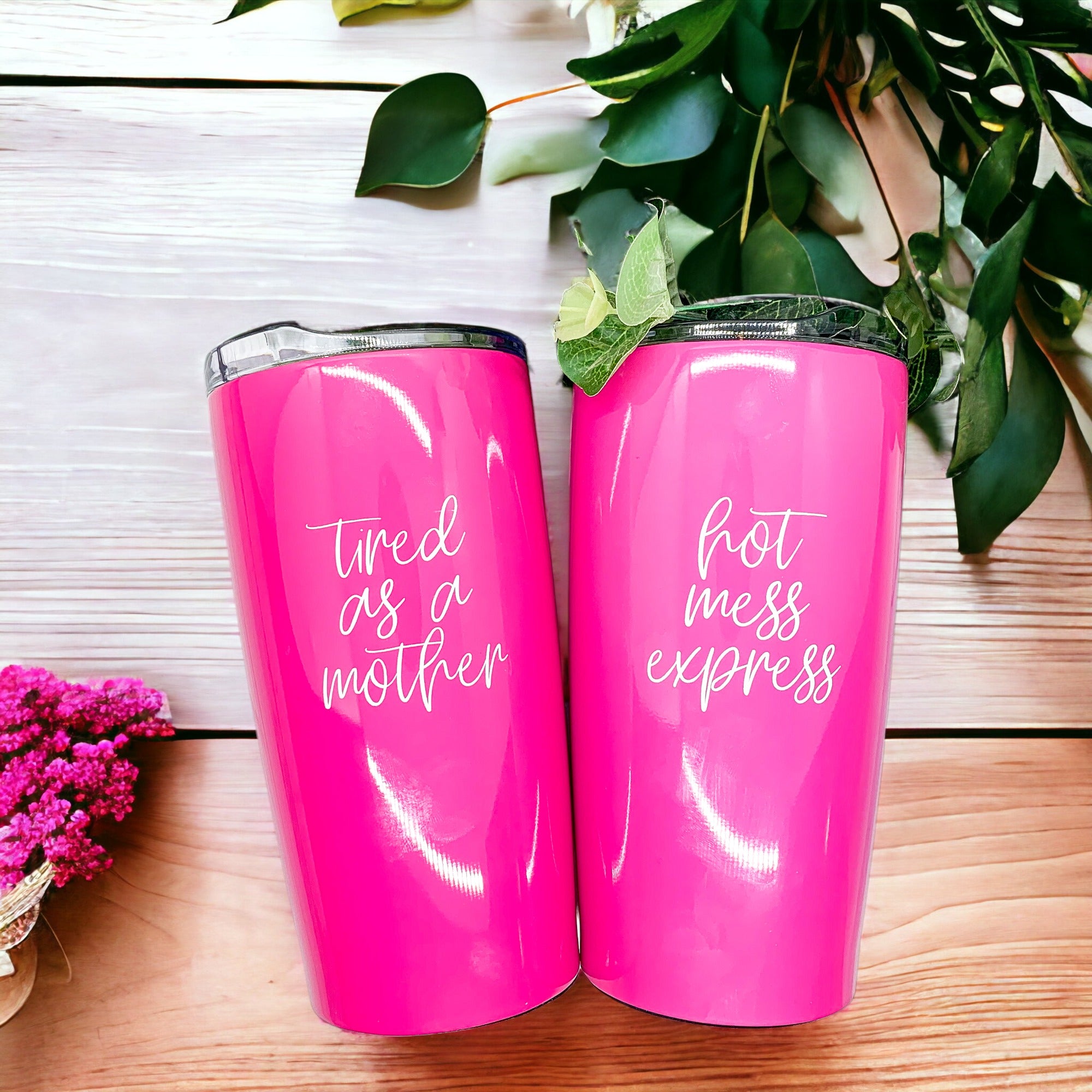 Two pink travel mugs.