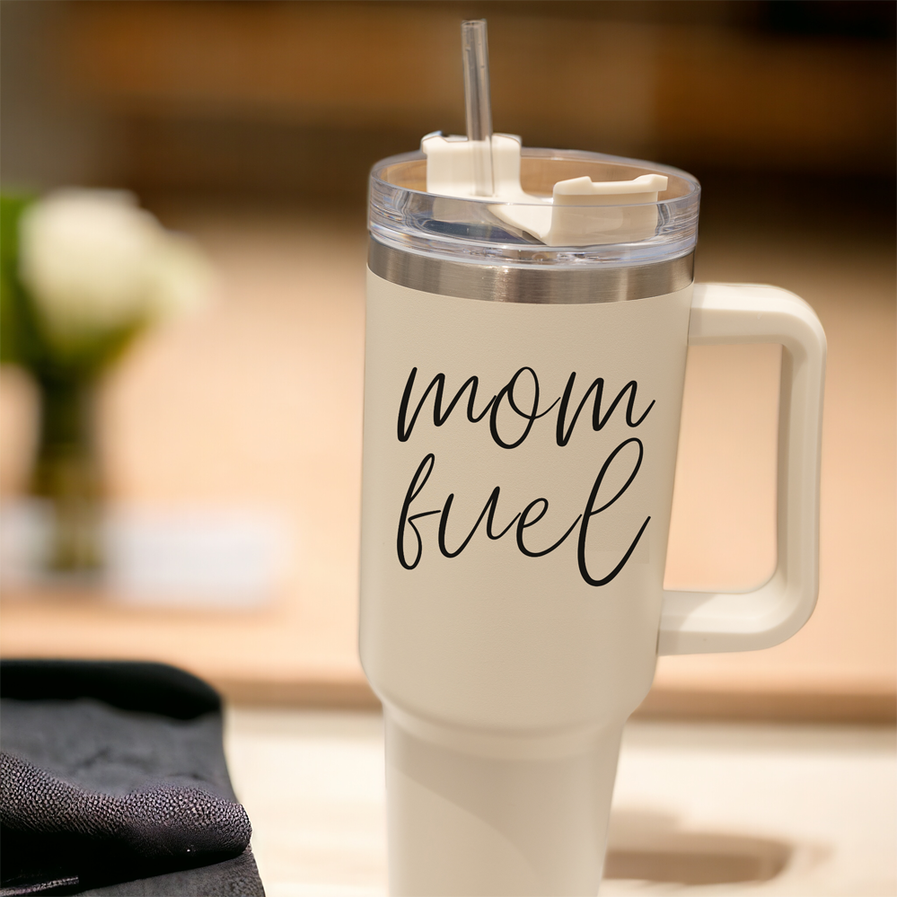 Mom Fuel 40oz tumbler with a cream exterior and black graphic design, showcasing its double insulated structure and versatile 3-in-1 lid.