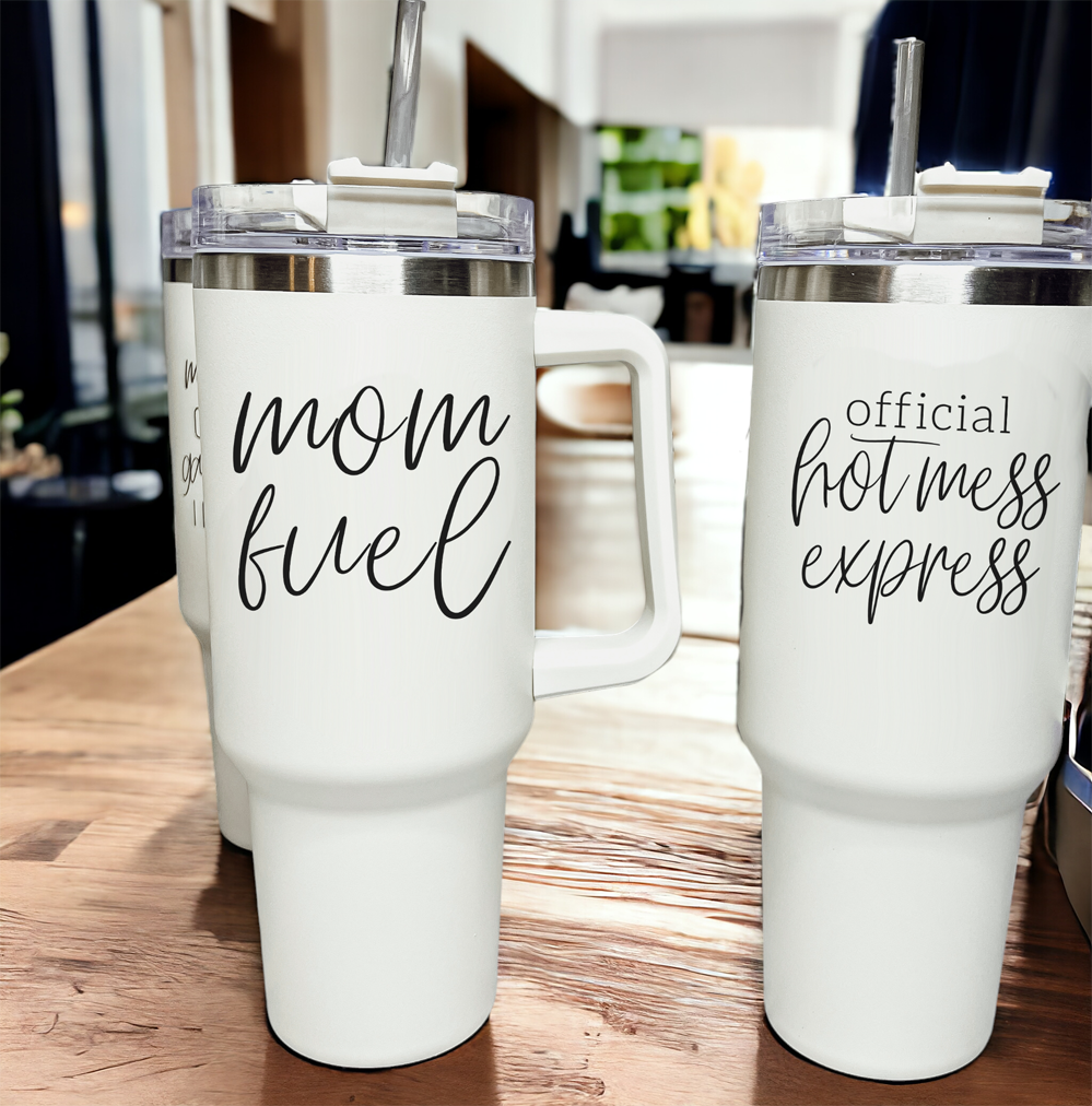 Mom Fuel 40oz tumbler with a cream exterior and black graphic design, showcasing its double insulated structure and versatile 3-in-1 lid.