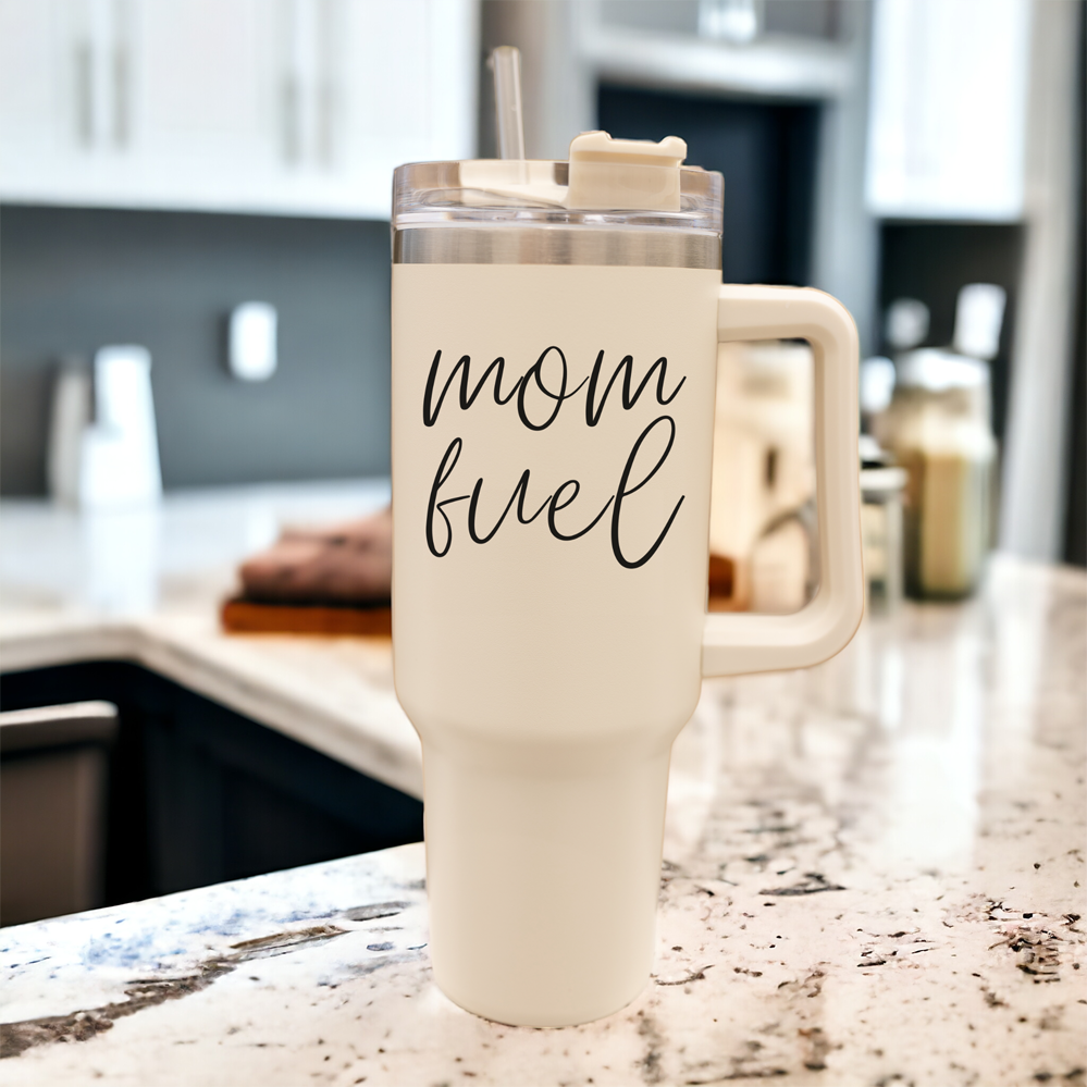 Mom Fuel 40oz tumbler with a cream exterior and black graphic design, showcasing its double insulated structure and versatile 3-in-1 lid.