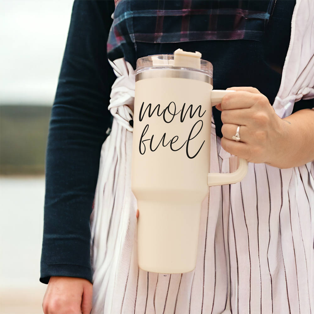 Mom Fuel 40oz tumbler with a cream exterior and black graphic design, showcasing its double insulated structure and versatile 3-in-1 lid.