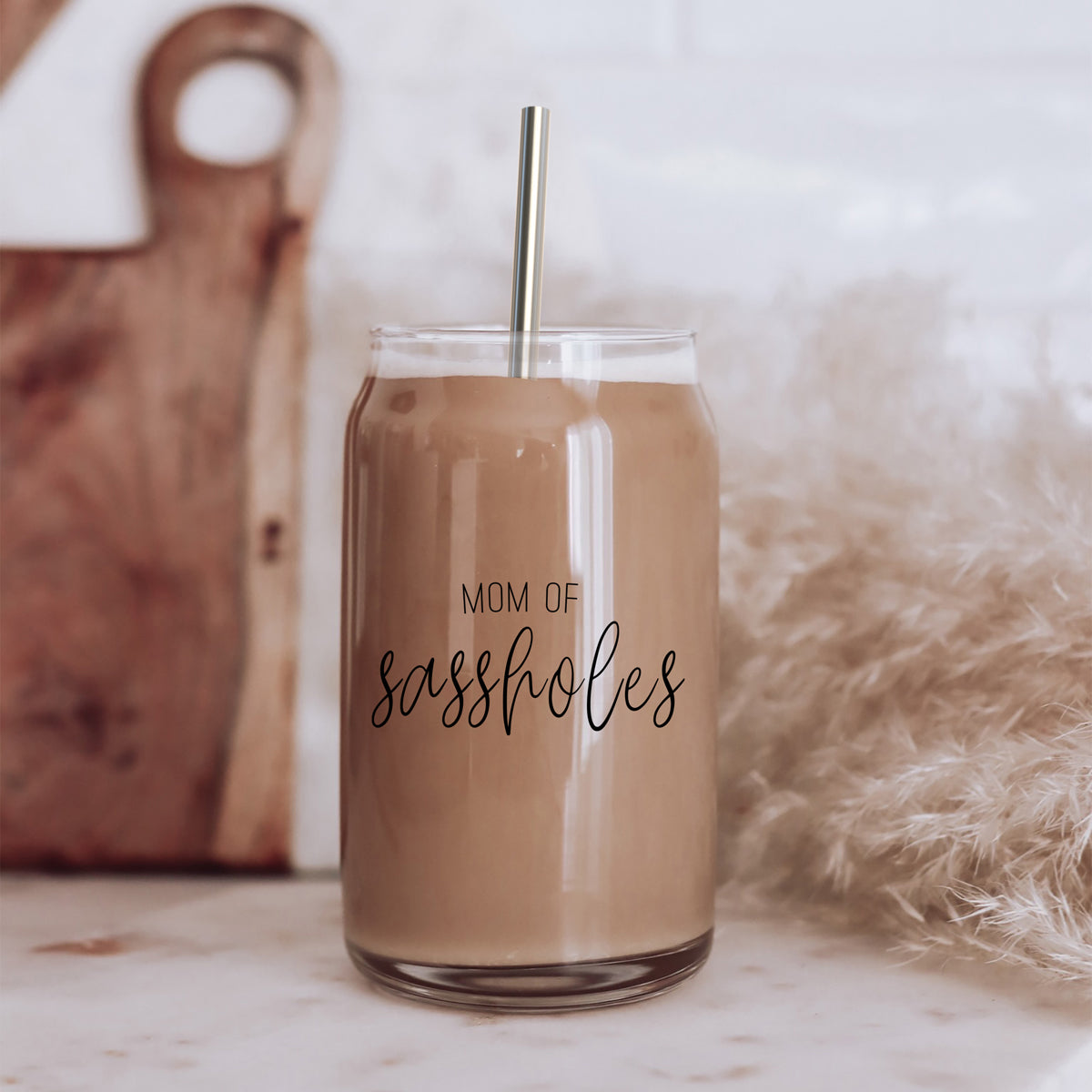 Mom of Sassholes Set featuring stylish glass cups with bamboo lids, stainless steel straws, and a straw cleaner, perfect for sassy moms.