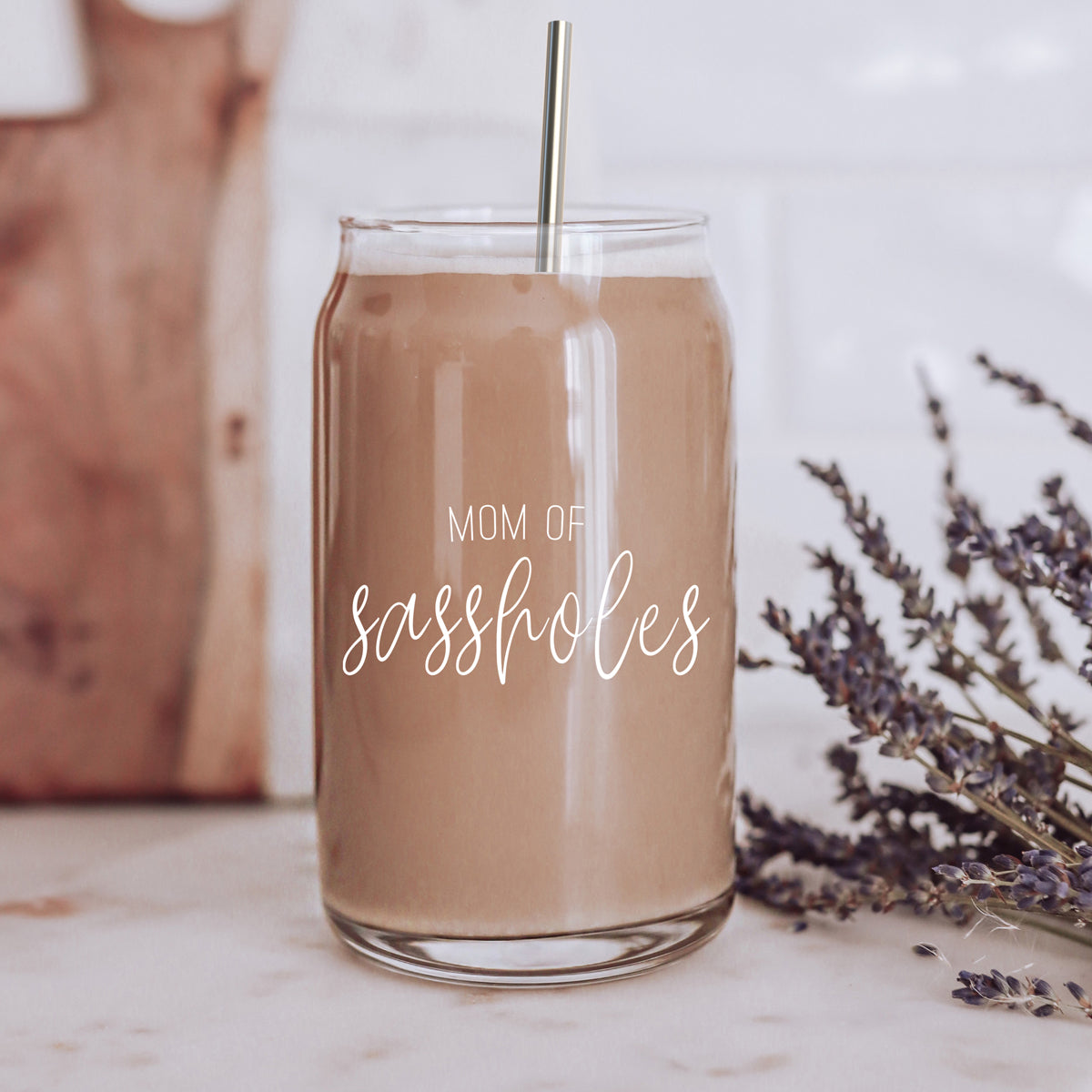 Mom of Sassholes Set featuring stylish glass cups with bamboo lids, stainless steel straws, and a straw cleaner, perfect for sassy moms.