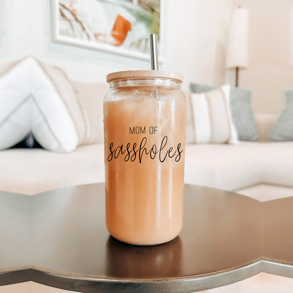 Mom of Sassholes Set featuring stylish glass cups with bamboo lids, stainless steel straws, and a straw cleaner, perfect for sassy moms.