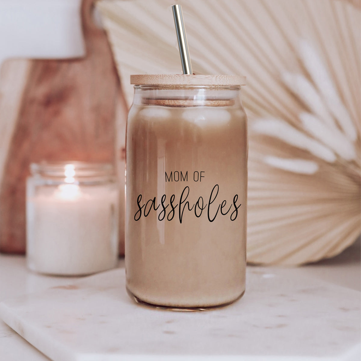 Mom of Sassholes Set featuring stylish glass cups with bamboo lids, stainless steel straws, and a straw cleaner, perfect for sassy moms.