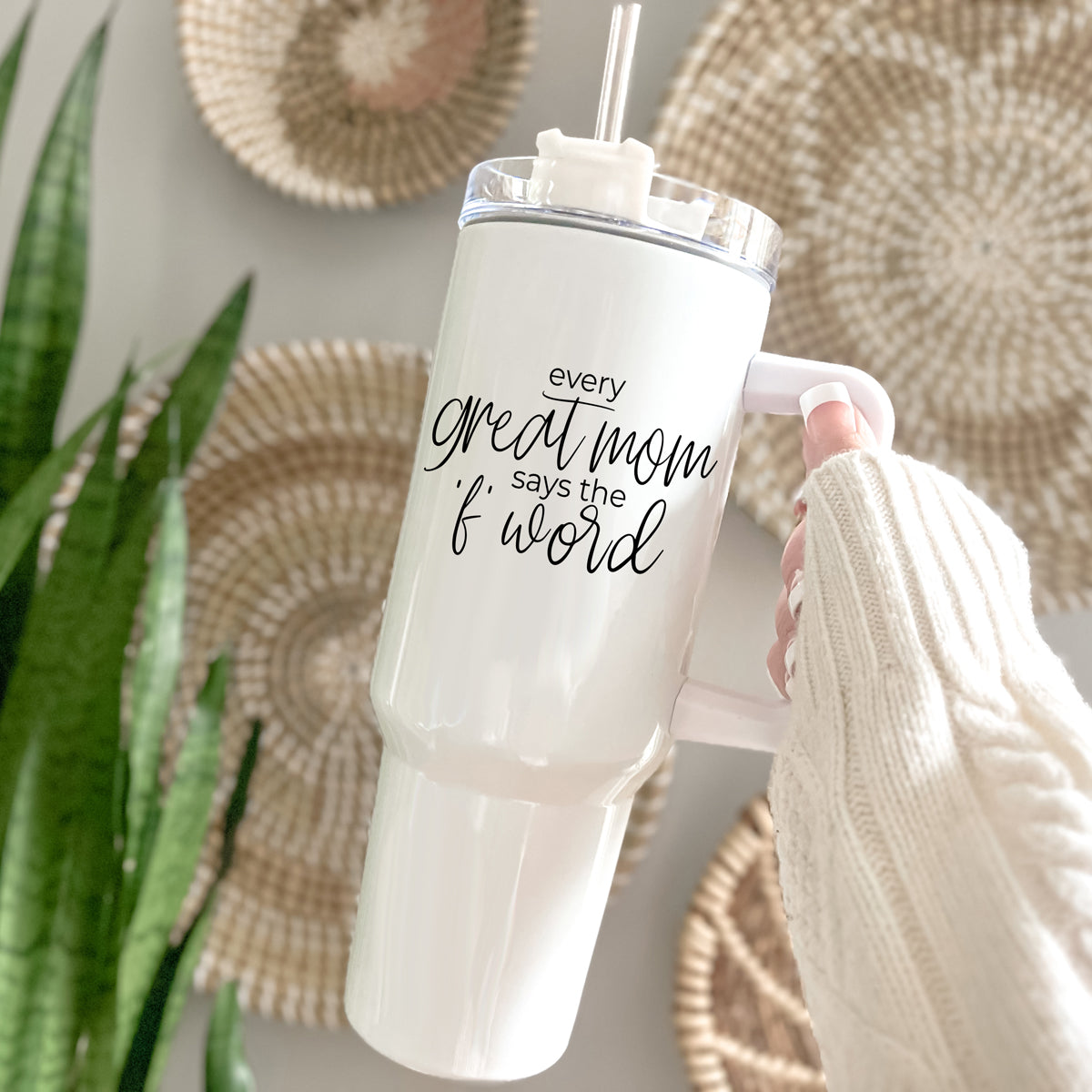 Mom Says the F Word 40oz insulated mug with a matte cream finish, featuring a black graphic design, a removable 3-in-1 lid, and a plastic straw.